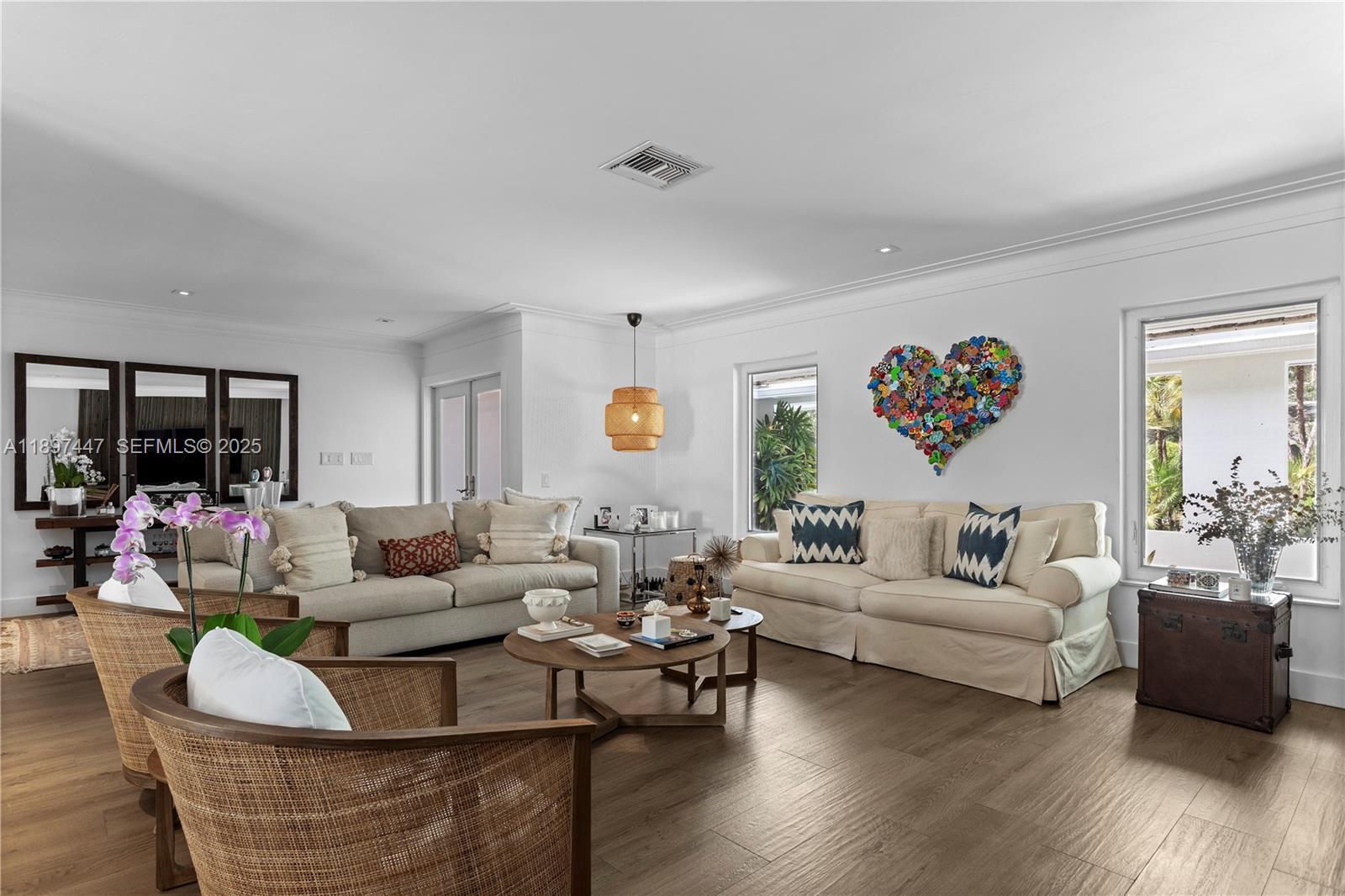13551 Southwest 62nd Avenue Pinecrest, FL 33156 - Photo 11 of 70 a living room with furniture and a large window