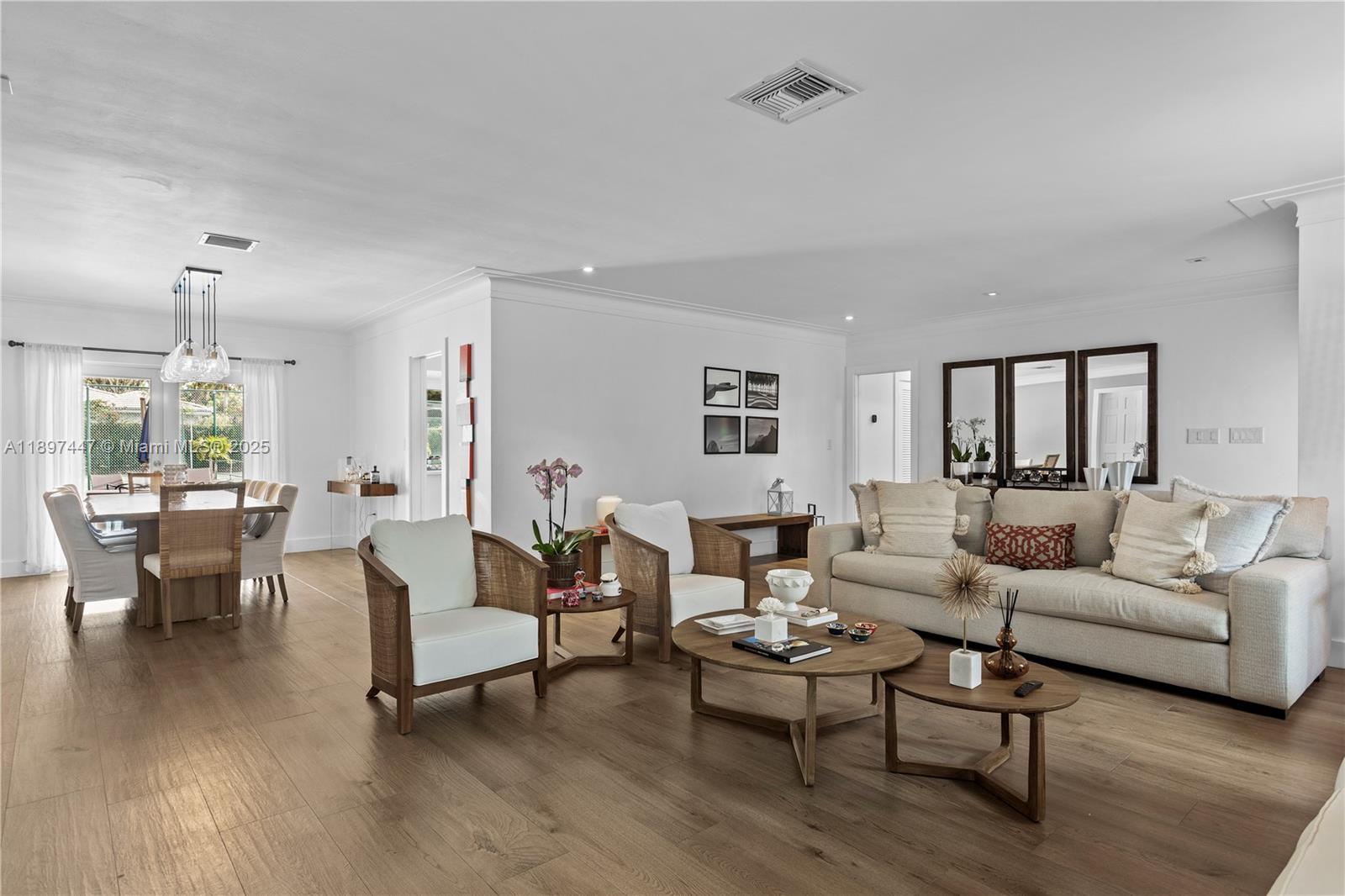 13551 Southwest 62nd Avenue Pinecrest, FL 33156 - Photo 12 of 70 a living room with furniture and a wooden floor