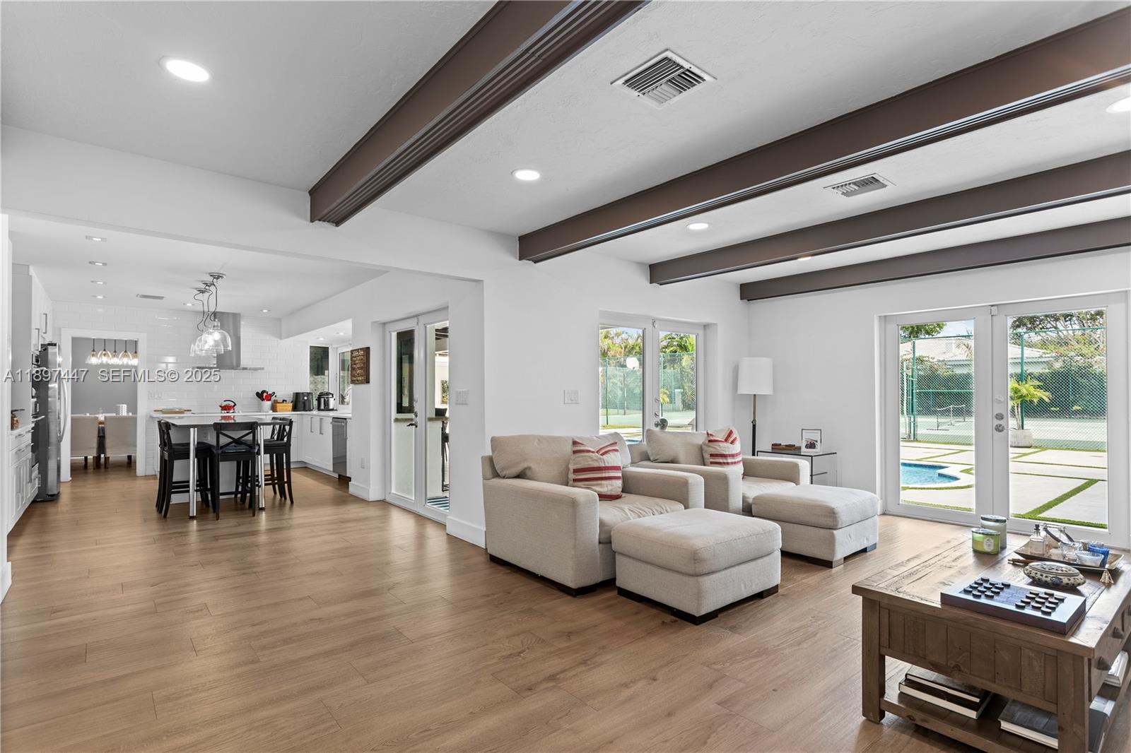 13551 Southwest 62nd Avenue Pinecrest, FL 33156 - Photo 15 of 70 a living room with furniture and wooden floor