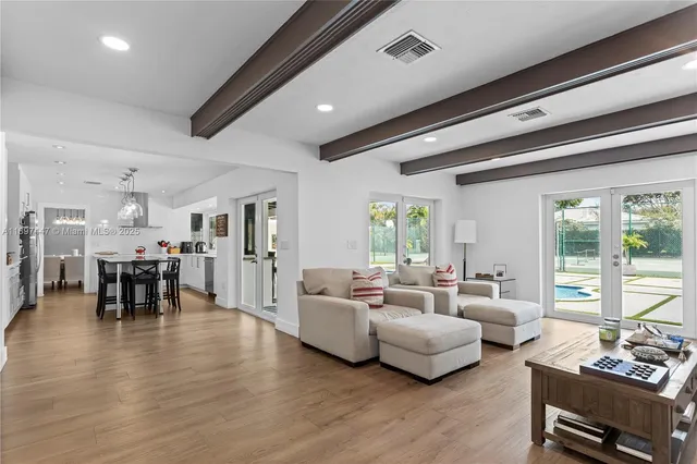 a living room with furniture and a rug