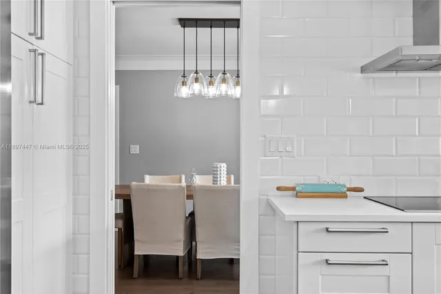 a bathroom with a double vanity sink mirror and shower