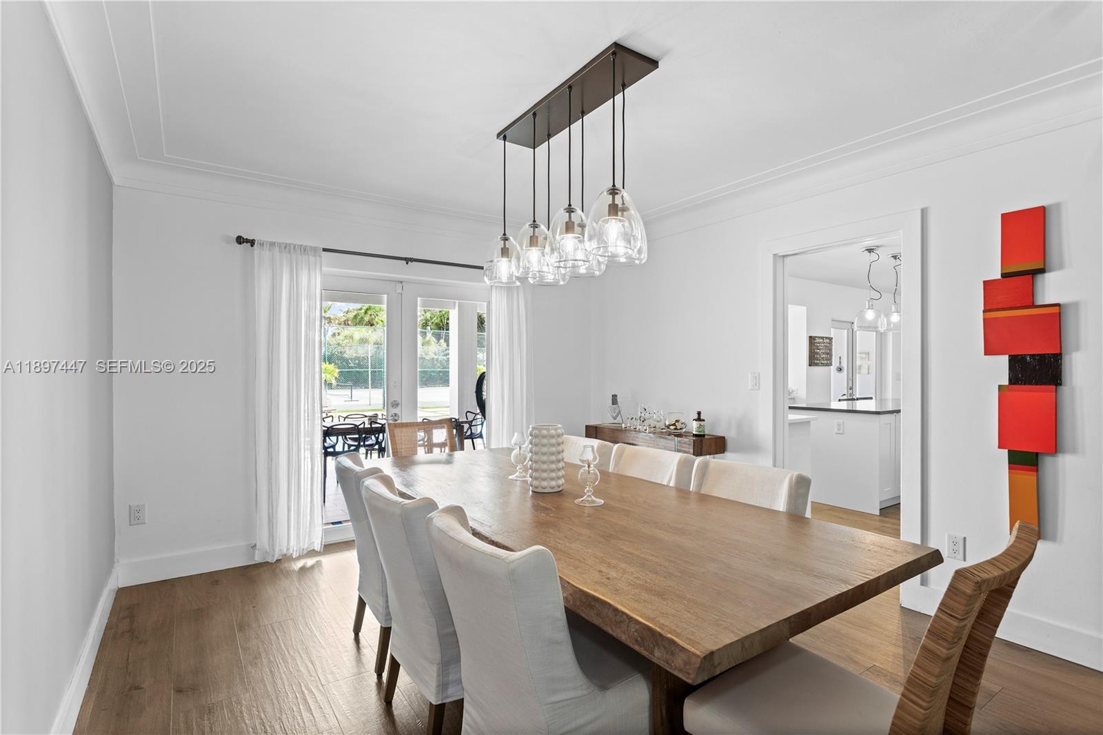 13551 Southwest 62nd Avenue Pinecrest, FL 33156 - Photo 26 of 70 a view of a dining room with furniture and chandelier
