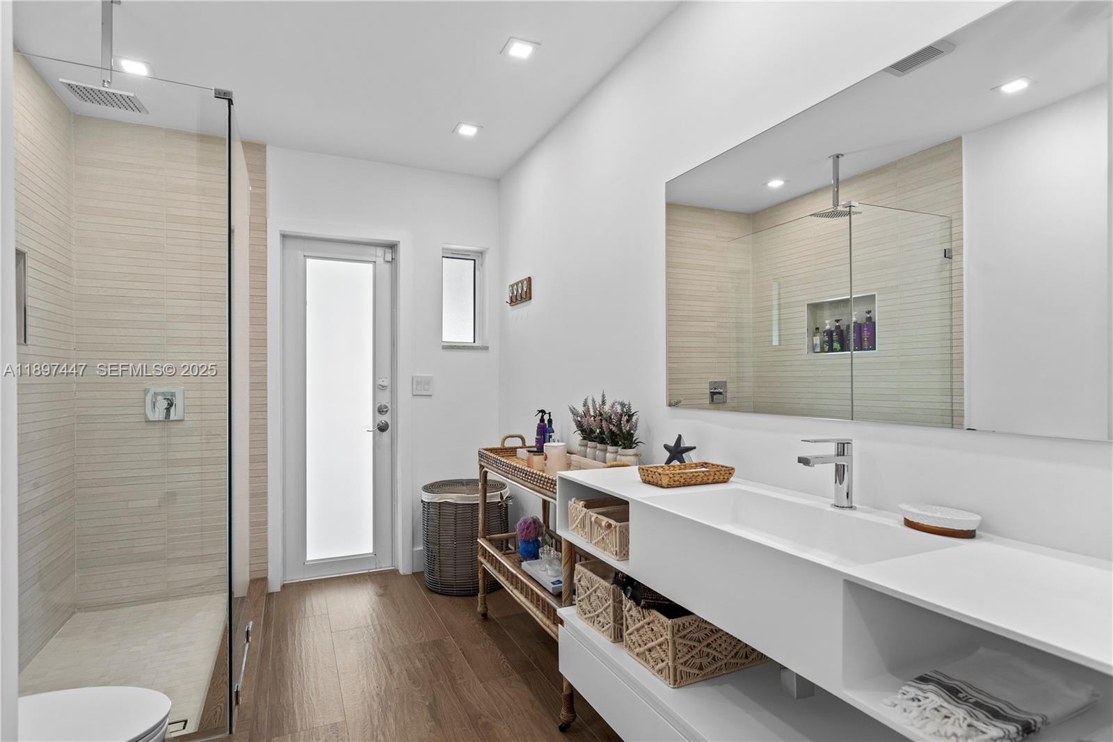 13551 Southwest 62nd Avenue Pinecrest, FL 33156 - Photo 28 of 70 a bathroom with a sink a toilet and shower