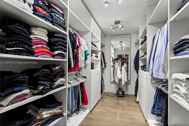 a room with a bed and a large window