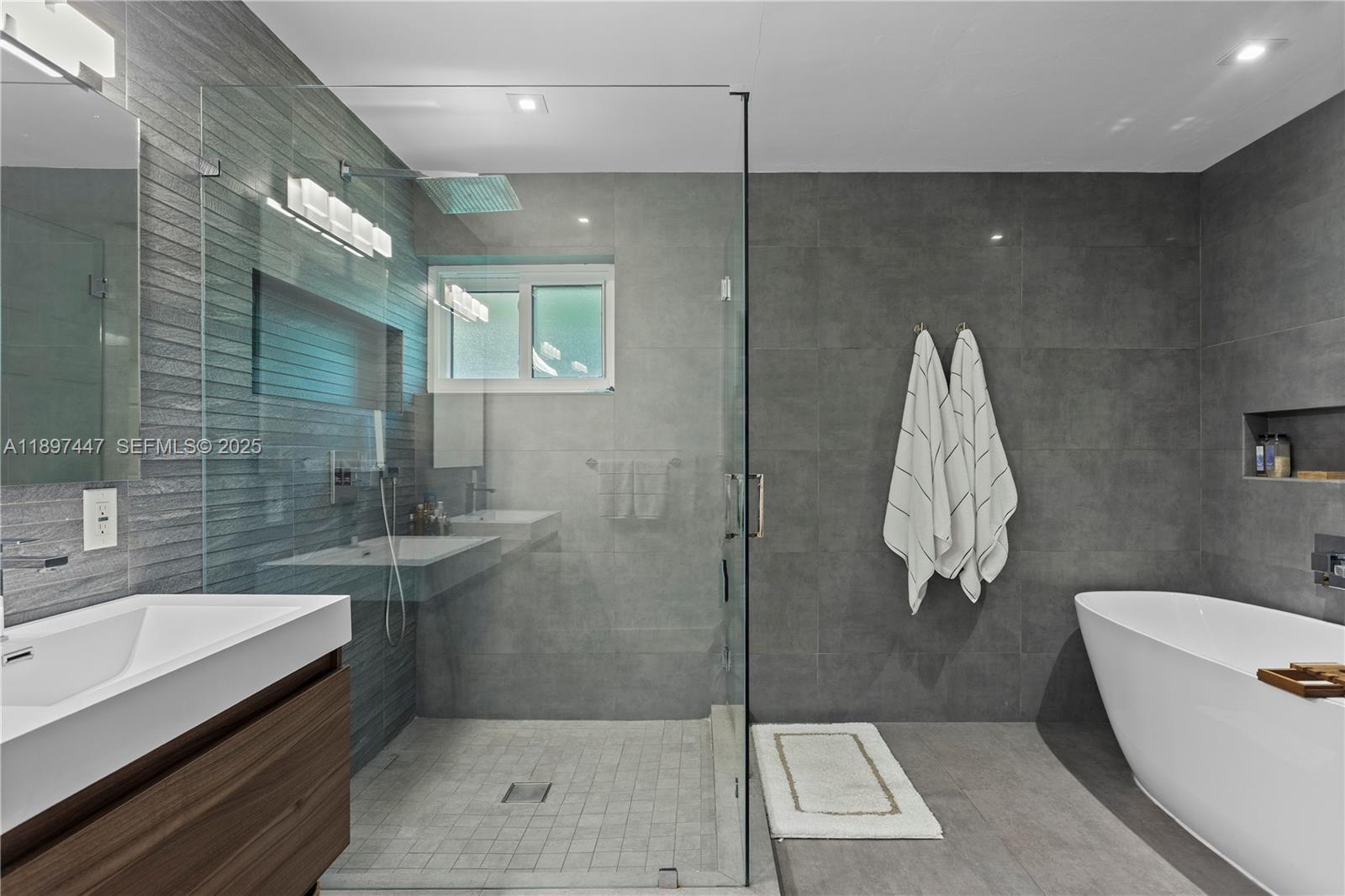 13551 Southwest 62nd Avenue Pinecrest, FL 33156 - Photo 34 of 70 a bathroom with a sink a toilet and shower