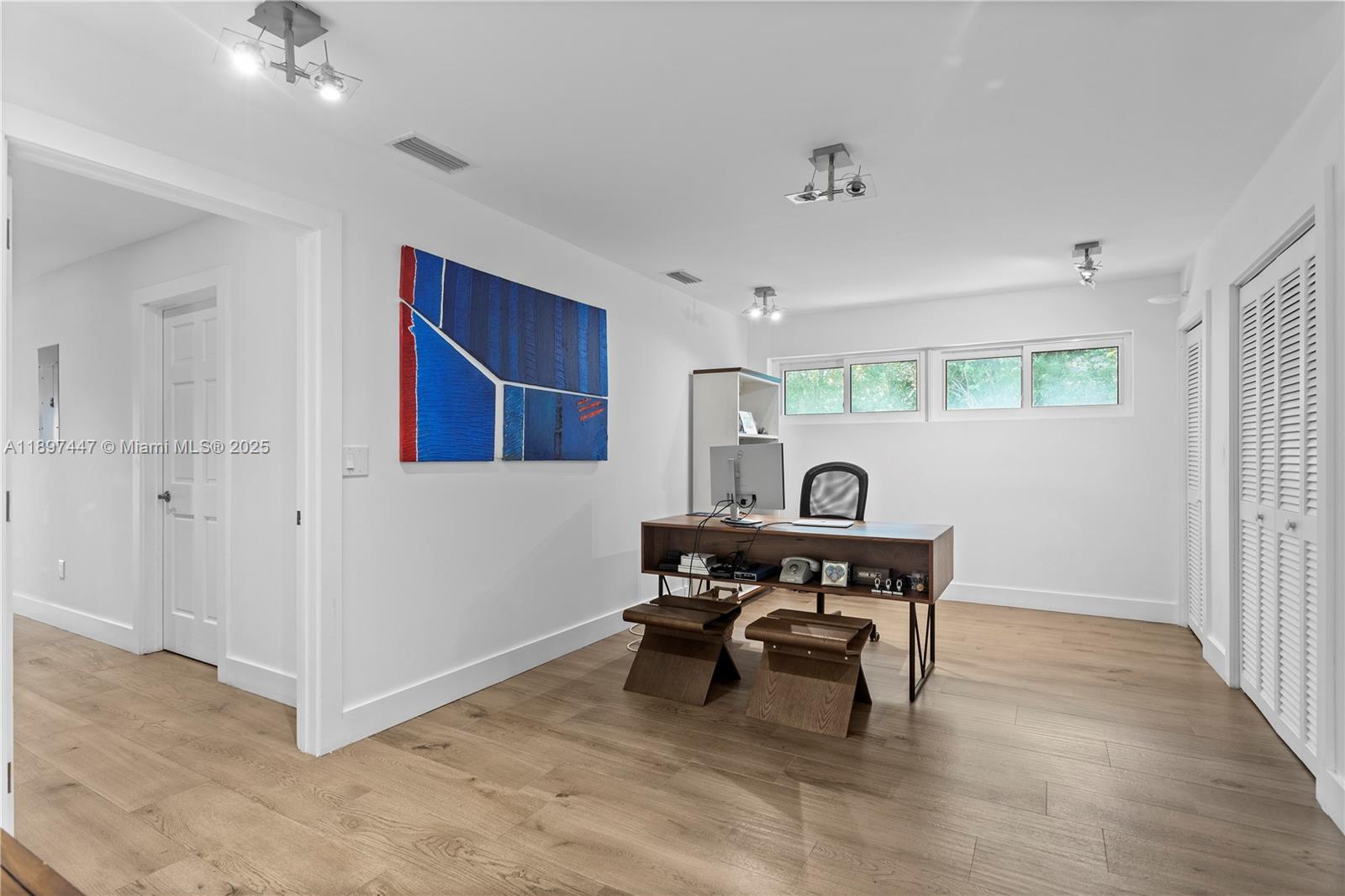 13551 Southwest 62nd Avenue Pinecrest, FL 33156 - Photo 36 of 70 a view of a workspace with furniture and a window