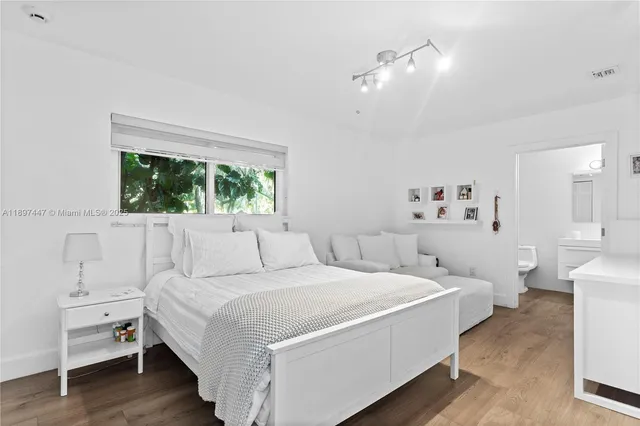 a view of a house with swimming pool and sitting area