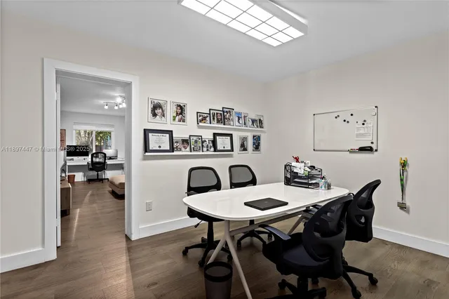 an aerial view of a house with yard swimming pool and outdoor seating