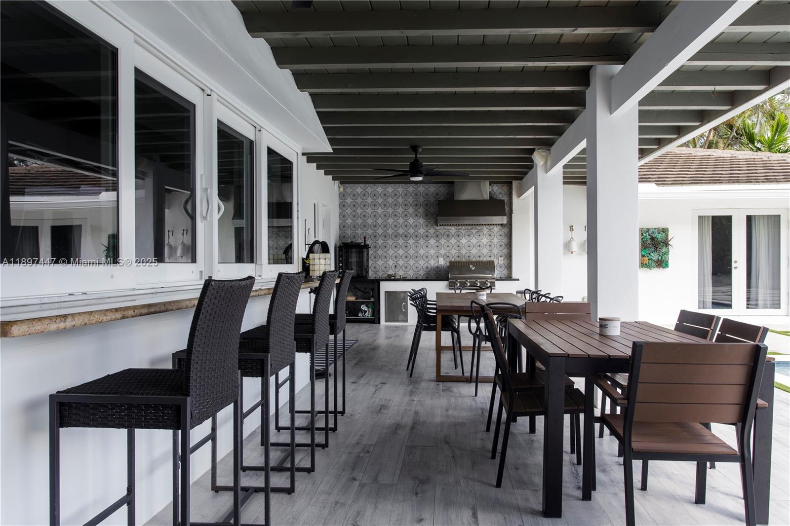 13551 Southwest 62nd Avenue Pinecrest, FL 33156 - Photo 57 of 70 a view of a dining room with furniture window and wooden floor