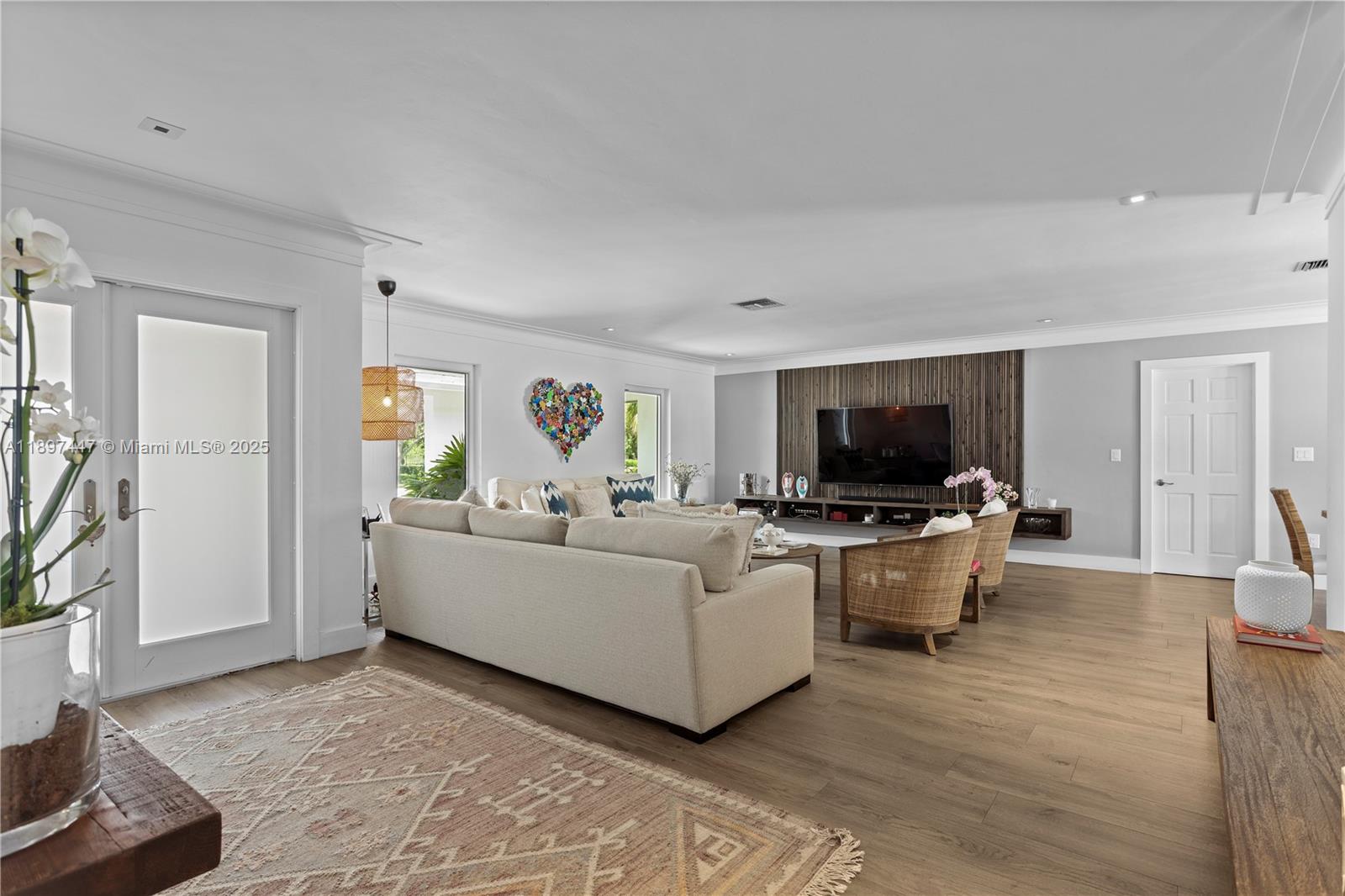 13551 Southwest 62nd Avenue Pinecrest, FL 33156 - Photo 6 of 70 a living room with furniture and a flat screen tv