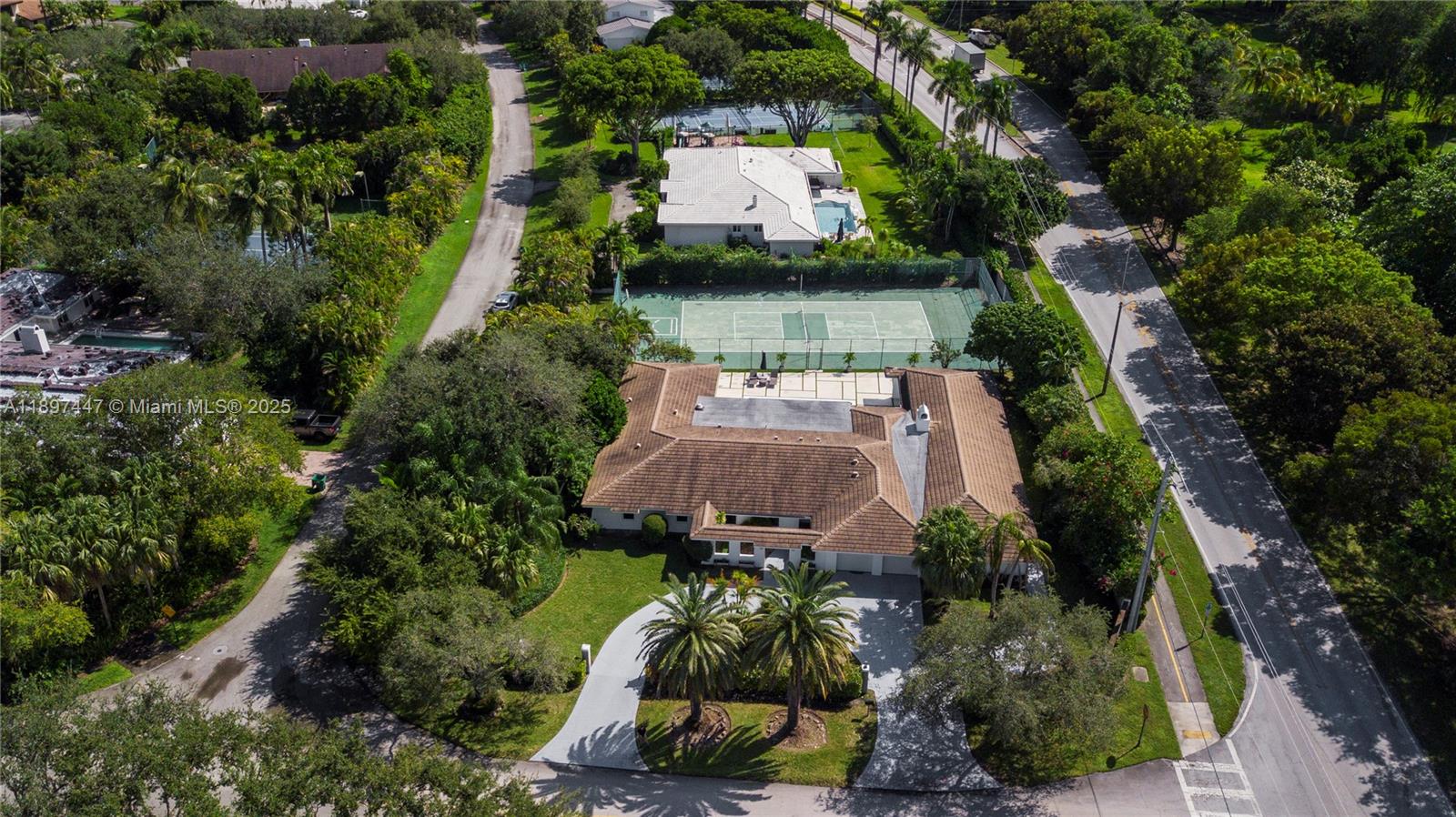 13551 Southwest 62nd Avenue Pinecrest, FL 33156 - Photo 63 of 70 an aerial view of a house with a garden and lake view