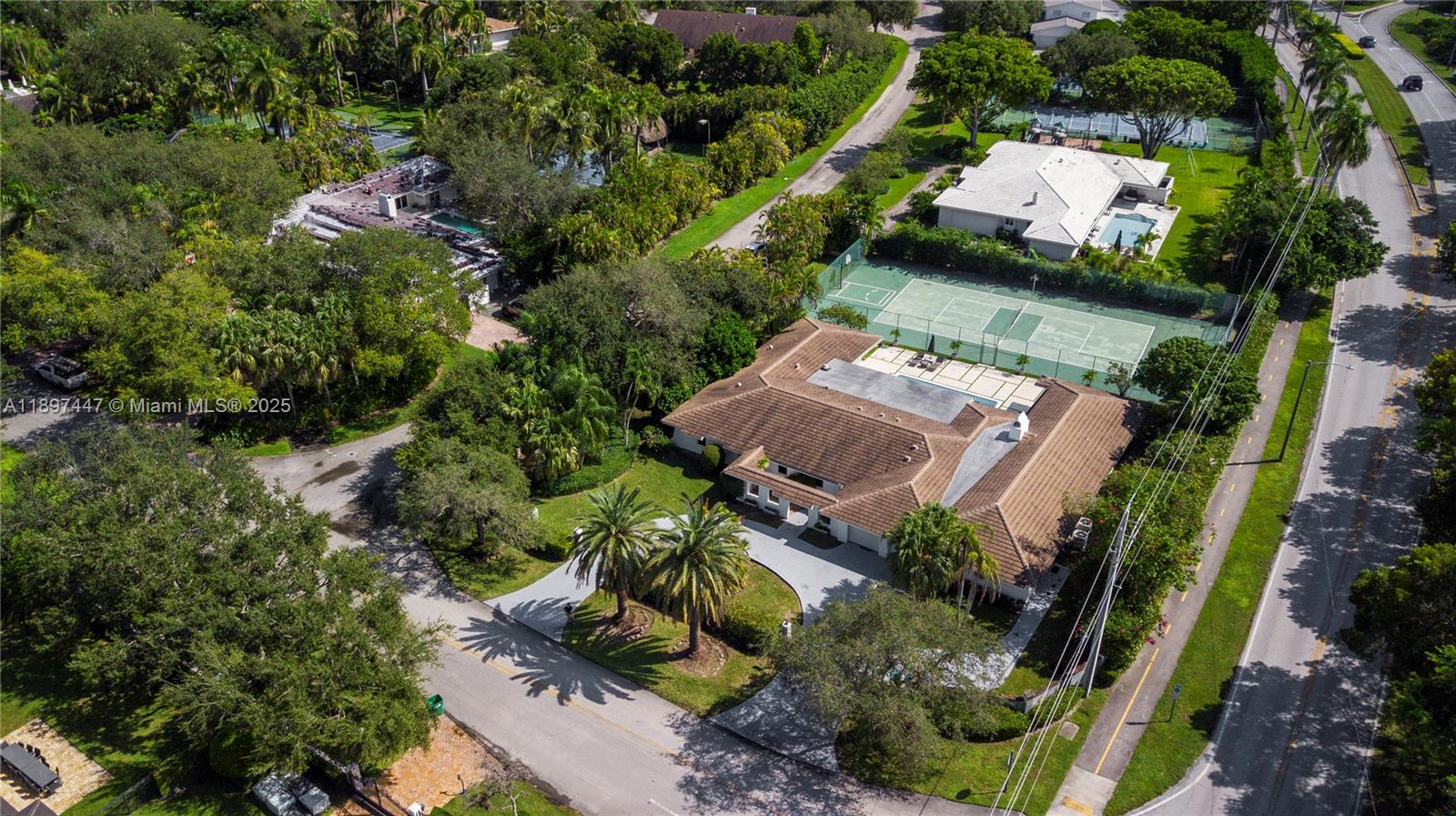13551 Southwest 62nd Avenue Pinecrest, FL 33156 - Photo 64 of 70 an aerial view of a house with yard swimming pool and outdoor seating
