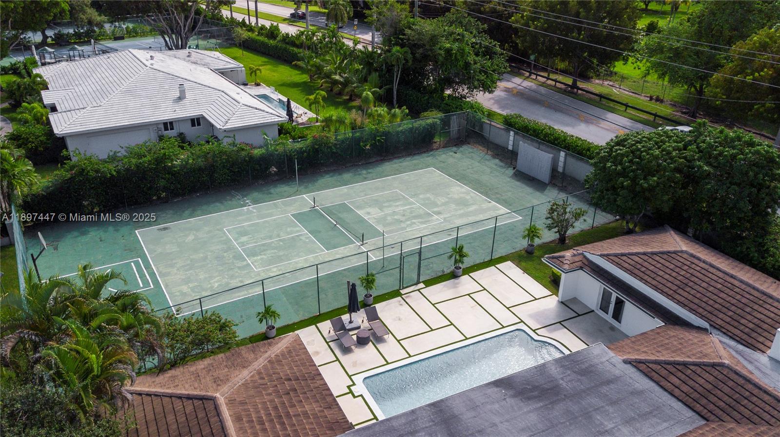 13551 Southwest 62nd Avenue Pinecrest, FL 33156 - Photo 68 of 70 an aerial view of a house with garden space and street view