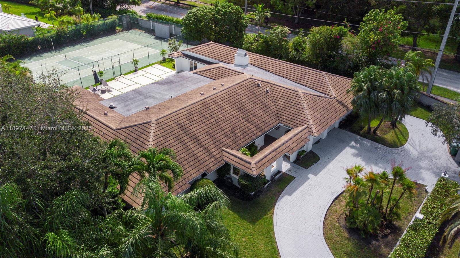 13551 Southwest 62nd Avenue Pinecrest, FL 33156 - Photo 69 of 70 an aerial view of a house with a yard and potted plants