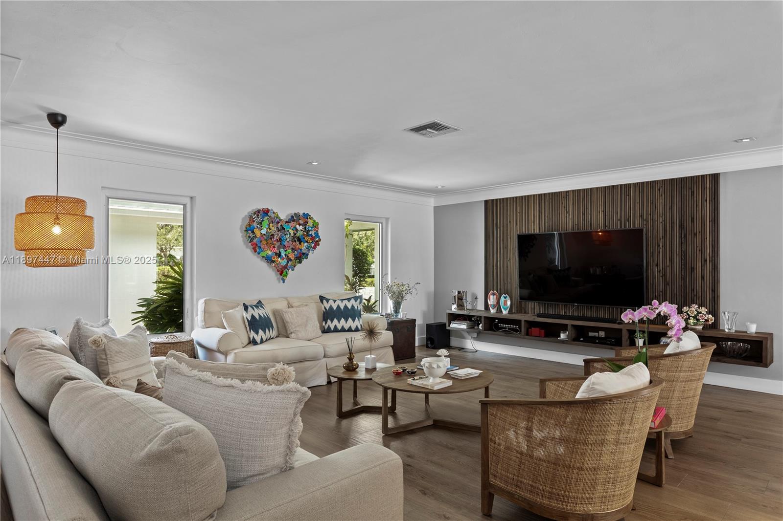 13551 Southwest 62nd Avenue Pinecrest, FL 33156 - Photo 9 of 70 a living room with furniture and a flat screen tv