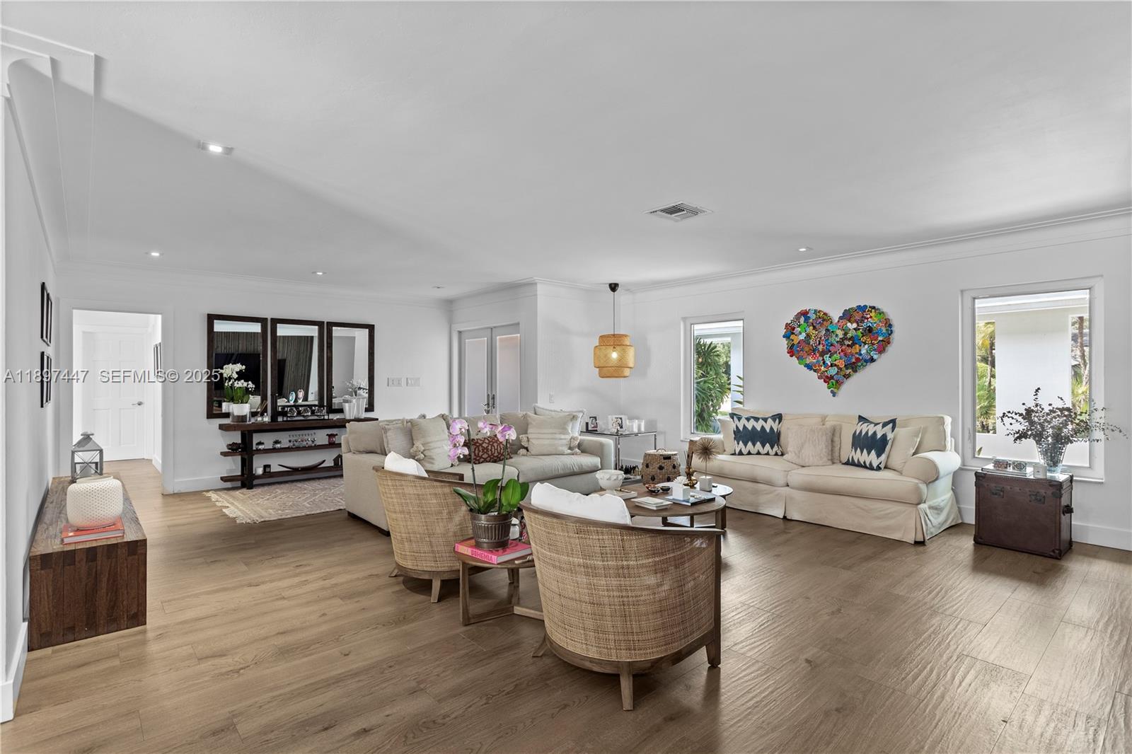 13551 Southwest 62nd Avenue Pinecrest, FL 33156 - Photo 10 of 70 a living room with furniture and a flat screen tv