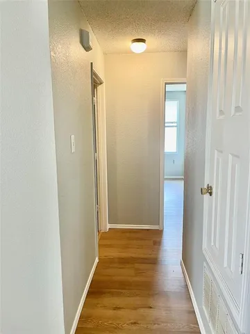 a view of a bathroom from a hallway