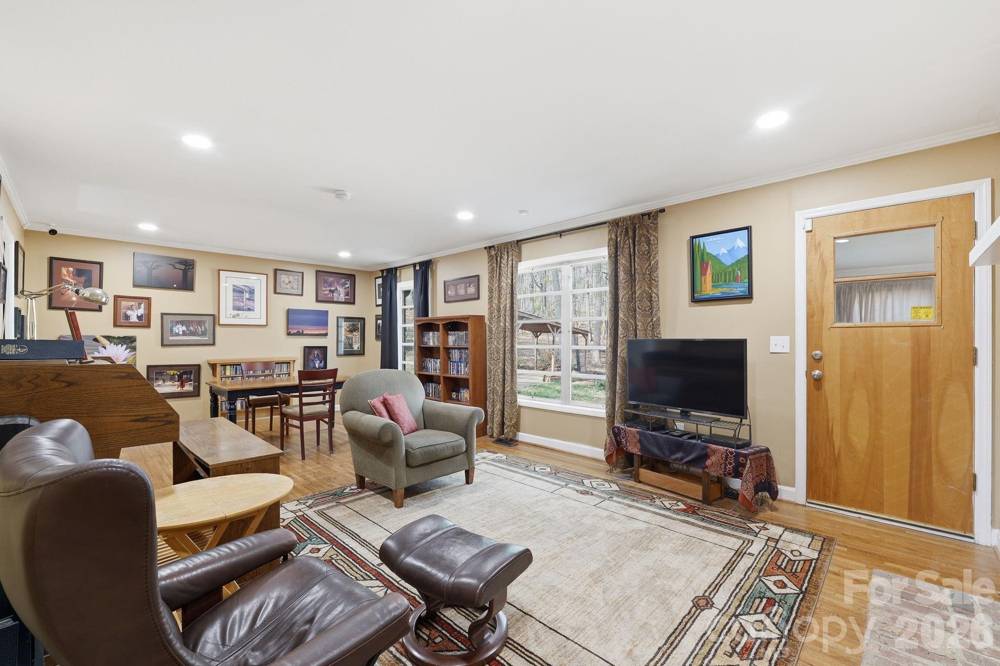 11715 Timber Ridge Road Charlotte, NC 28213 - Photo 16 of 38 a living room with furniture and a flat screen tv