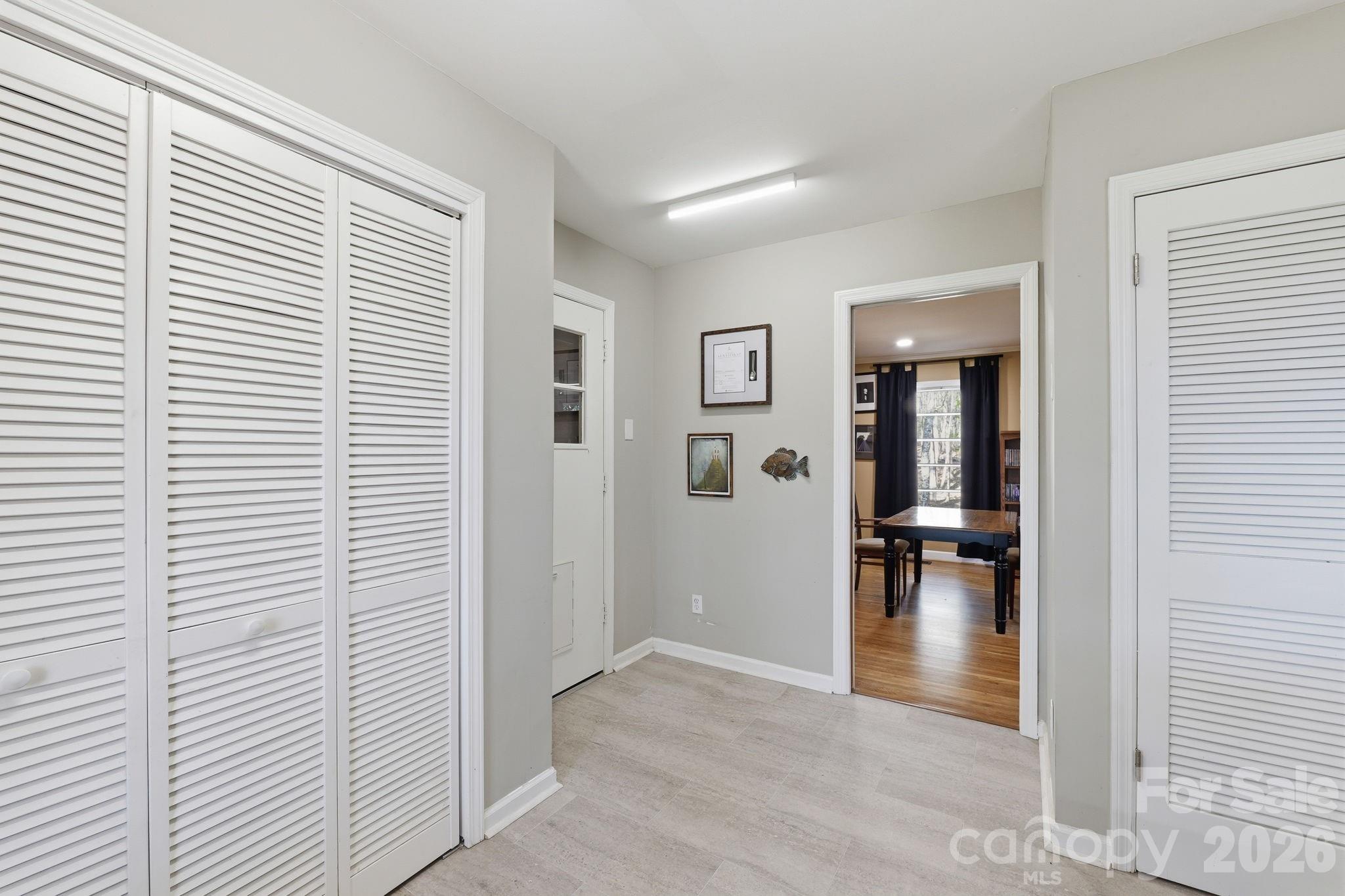 11715 Timber Ridge Road Charlotte, NC 28213 - Photo 17 of 38 a view of empty room with wooden floor and a window