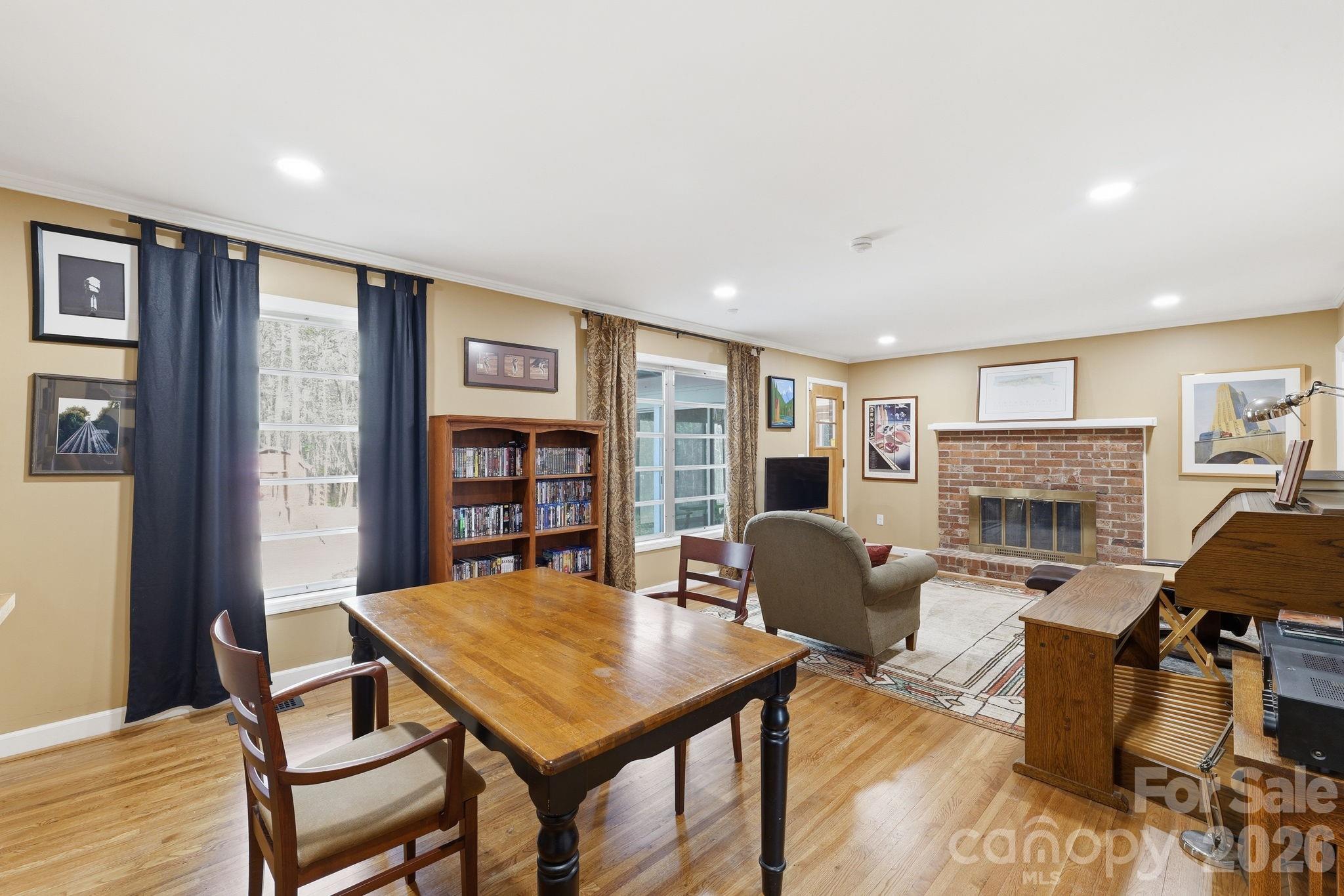 11715 Timber Ridge Road Charlotte, NC 28213 - Photo 19 of 38 a living room with furniture a table and a fireplace
