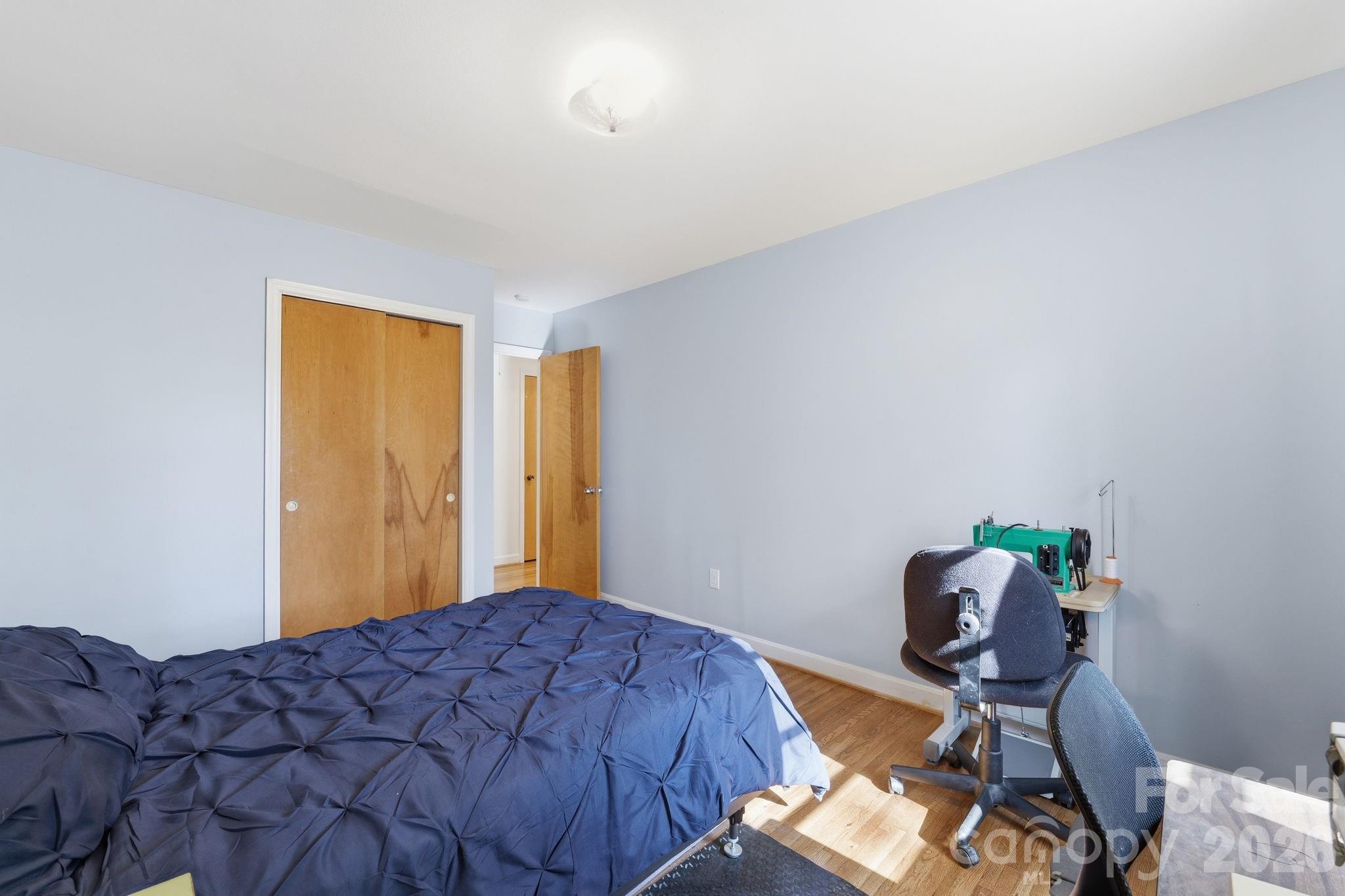 11715 Timber Ridge Road Charlotte, NC 28213 - Photo 33 of 38 a bedroom with a bed and chair