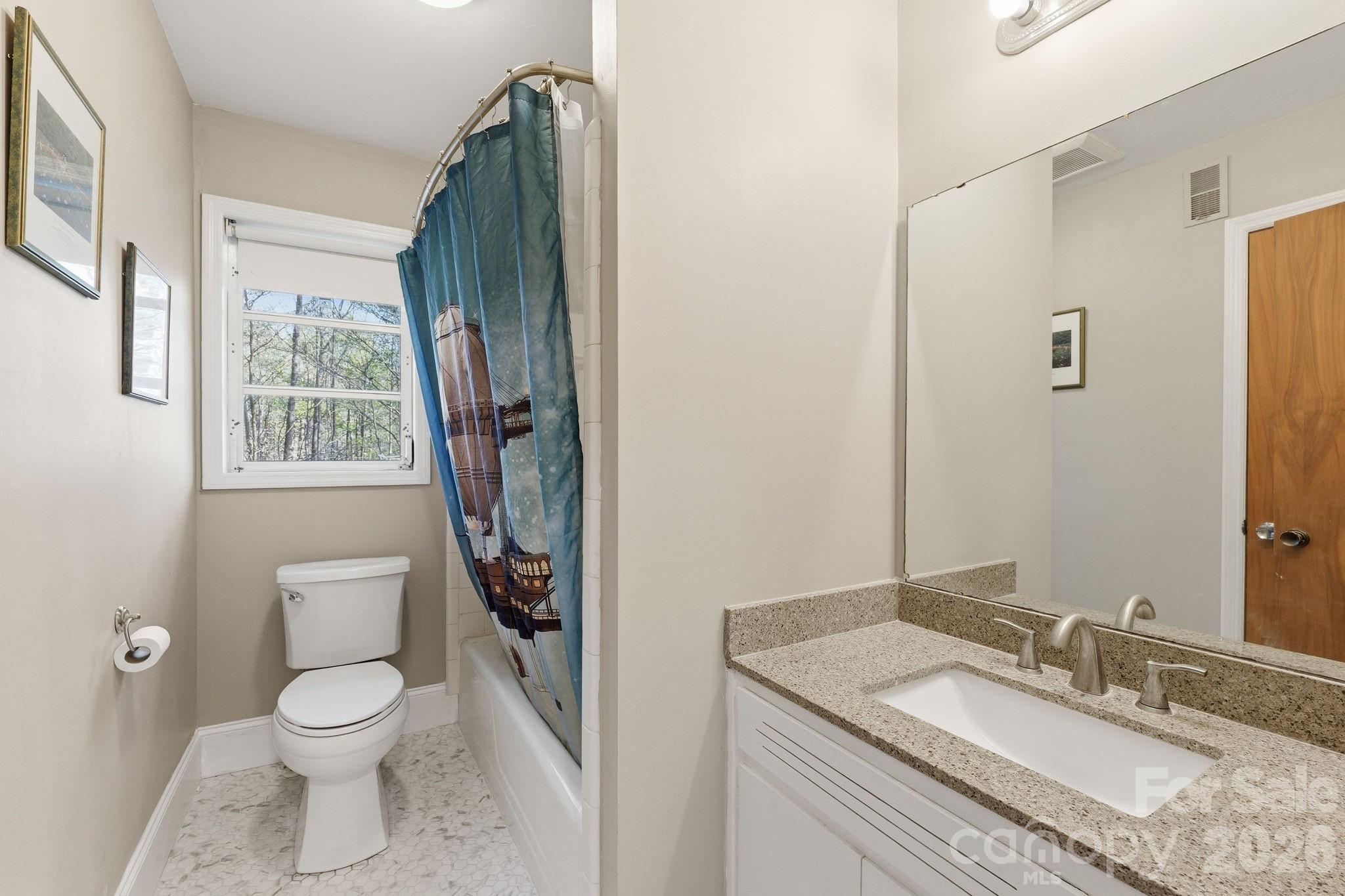 11715 Timber Ridge Road Charlotte, NC 28213 - Photo 34 of 38 a bathroom with a granite countertop sink toilet and shower