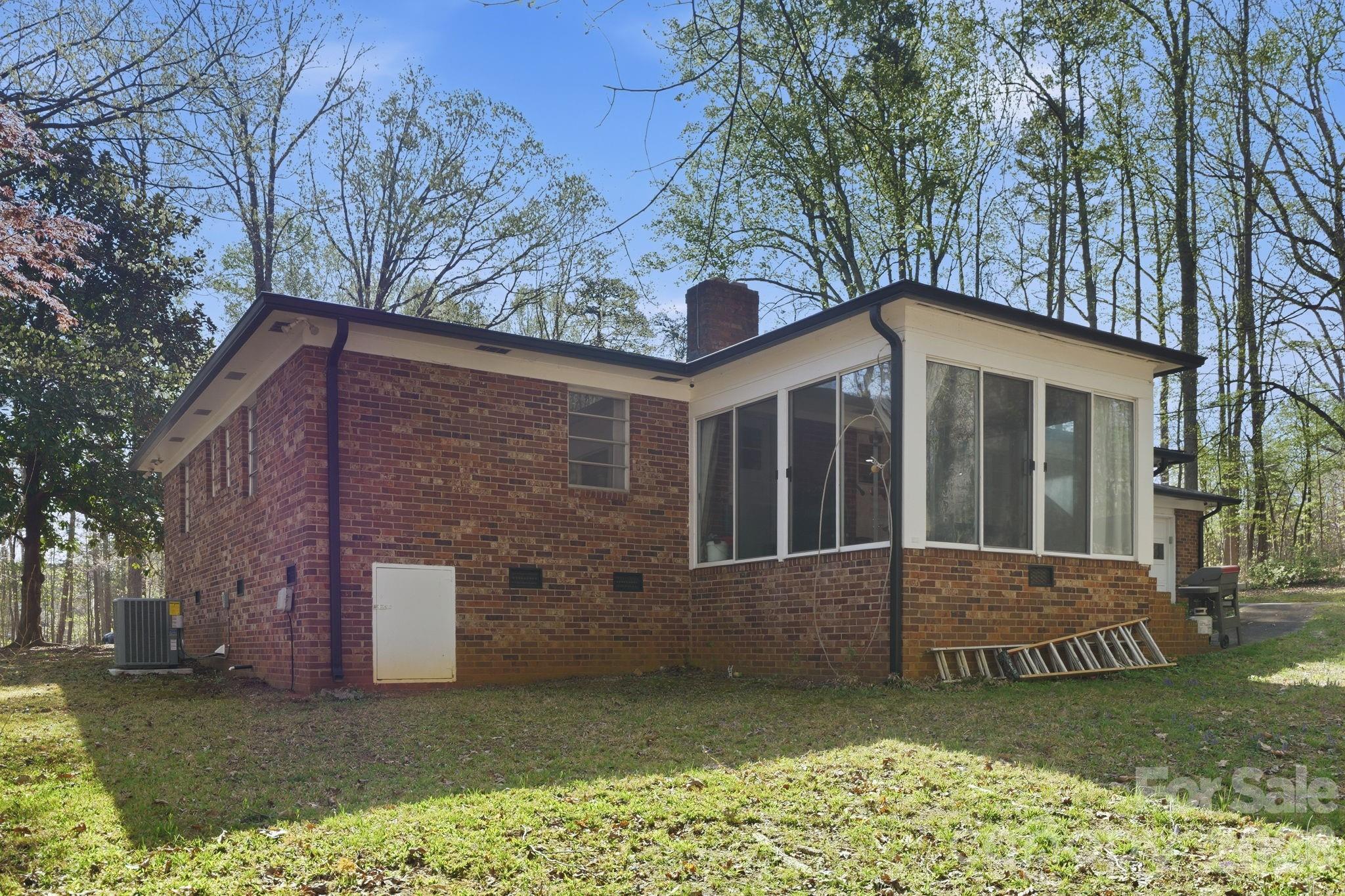11715 Timber Ridge Road Charlotte, NC 28213 - Photo 35 of 38 a front view of a house with a garden