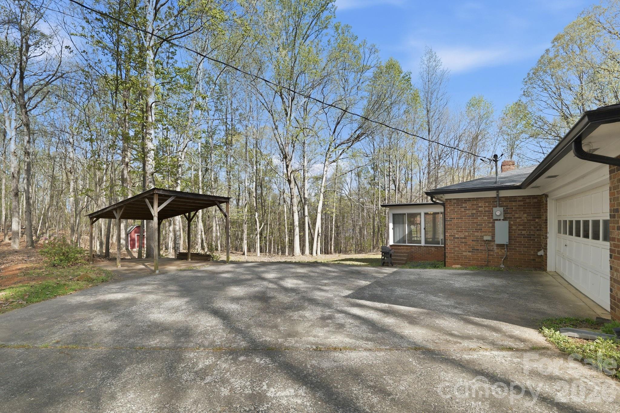 11715 Timber Ridge Road Charlotte, NC 28213 - Photo 37 of 38 a front view of a house with a yard
