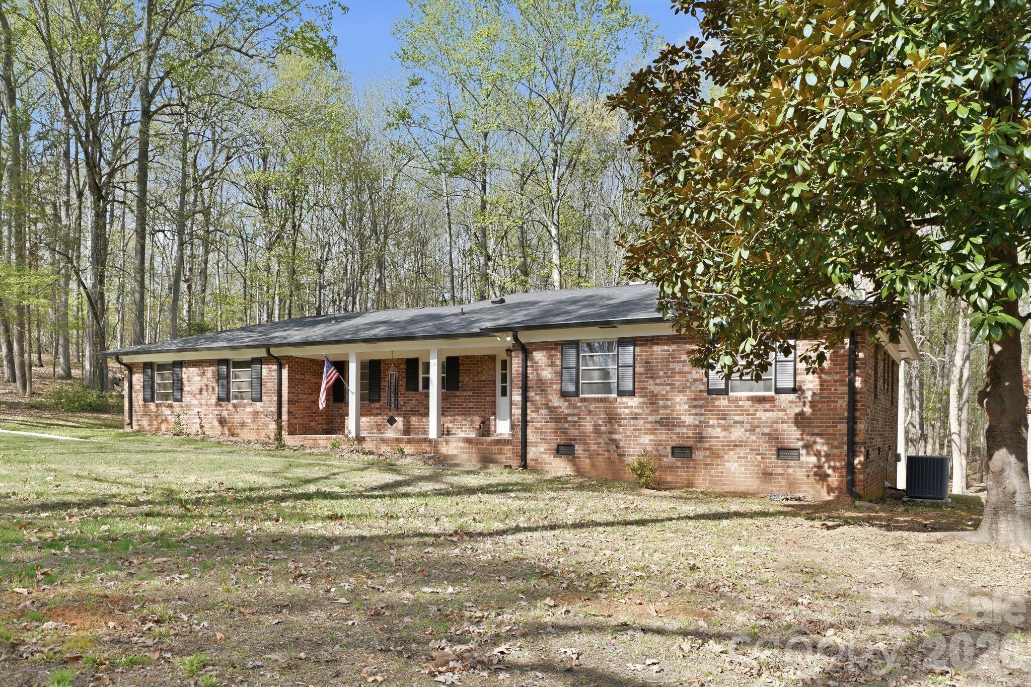 11715 Timber Ridge Road Charlotte, NC 28213 - Photo 38 of 38 a front view of a house with garden