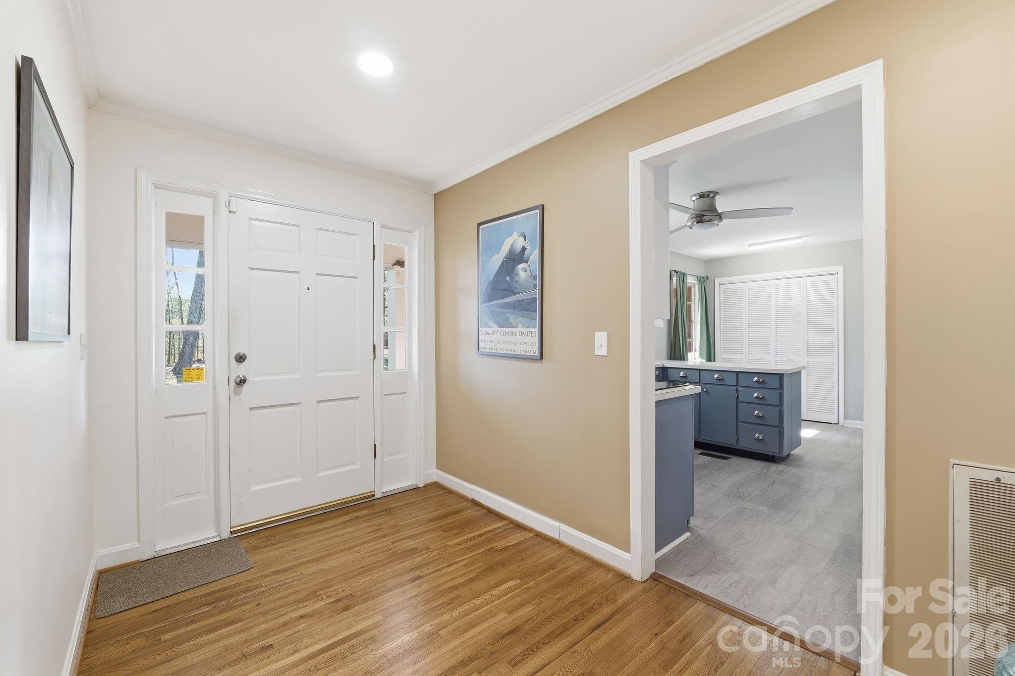 11715 Timber Ridge Road Charlotte, NC 28213 - Photo 5 of 38 a view of a hallway with wooden floor and closet