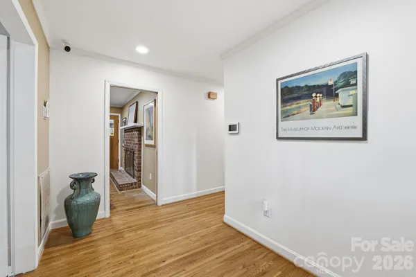 a view of room with wooden floor