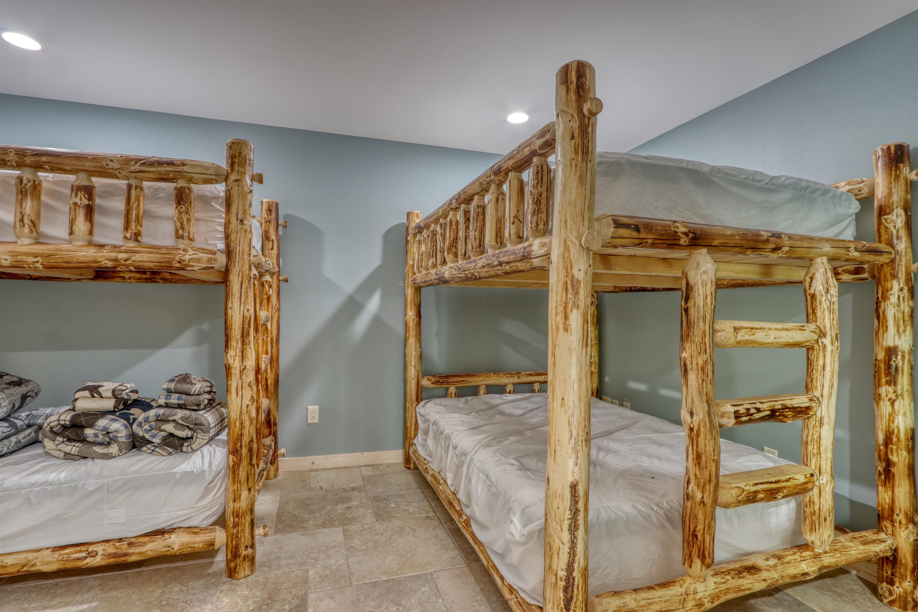 1881 County Road A Spooner, WI 54801 - Photo 44 of 54 Bedroom with recessed lighting, baseboards, and light stone finish flooring