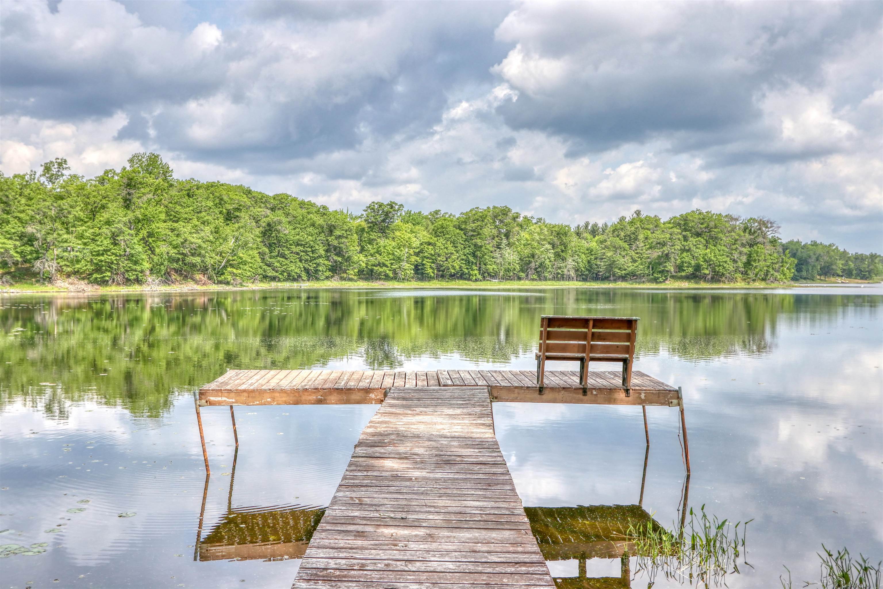 1881 County Road A Spooner, WI 54801 - Photo 8 of 54 Dock area with a water view and a forest view