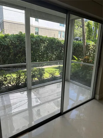 a view of a room with a large window