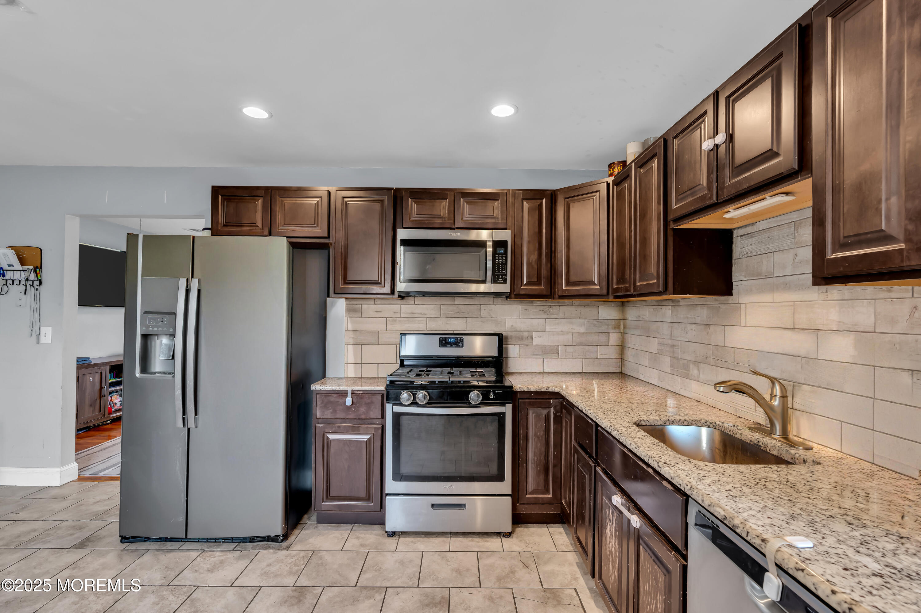 355 Western Boulevard Bayville, NJ 08721 - Photo 11 of 39 a kitchen with a sink a stove top oven a refrigerator and a cabinets