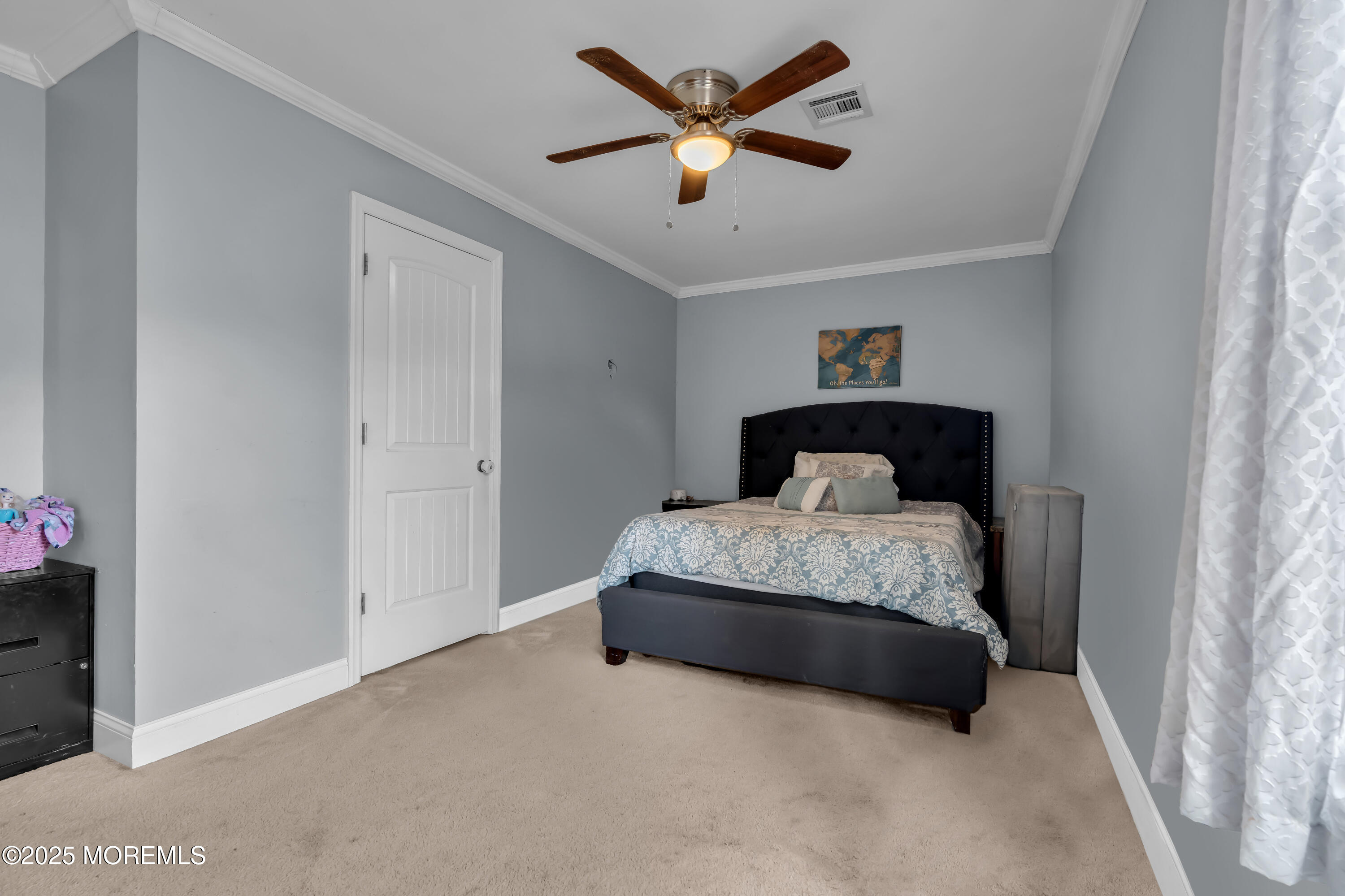 355 Western Boulevard Bayville, NJ 08721 - Photo 15 of 39 a bedroom with a bed and a ceiling fan