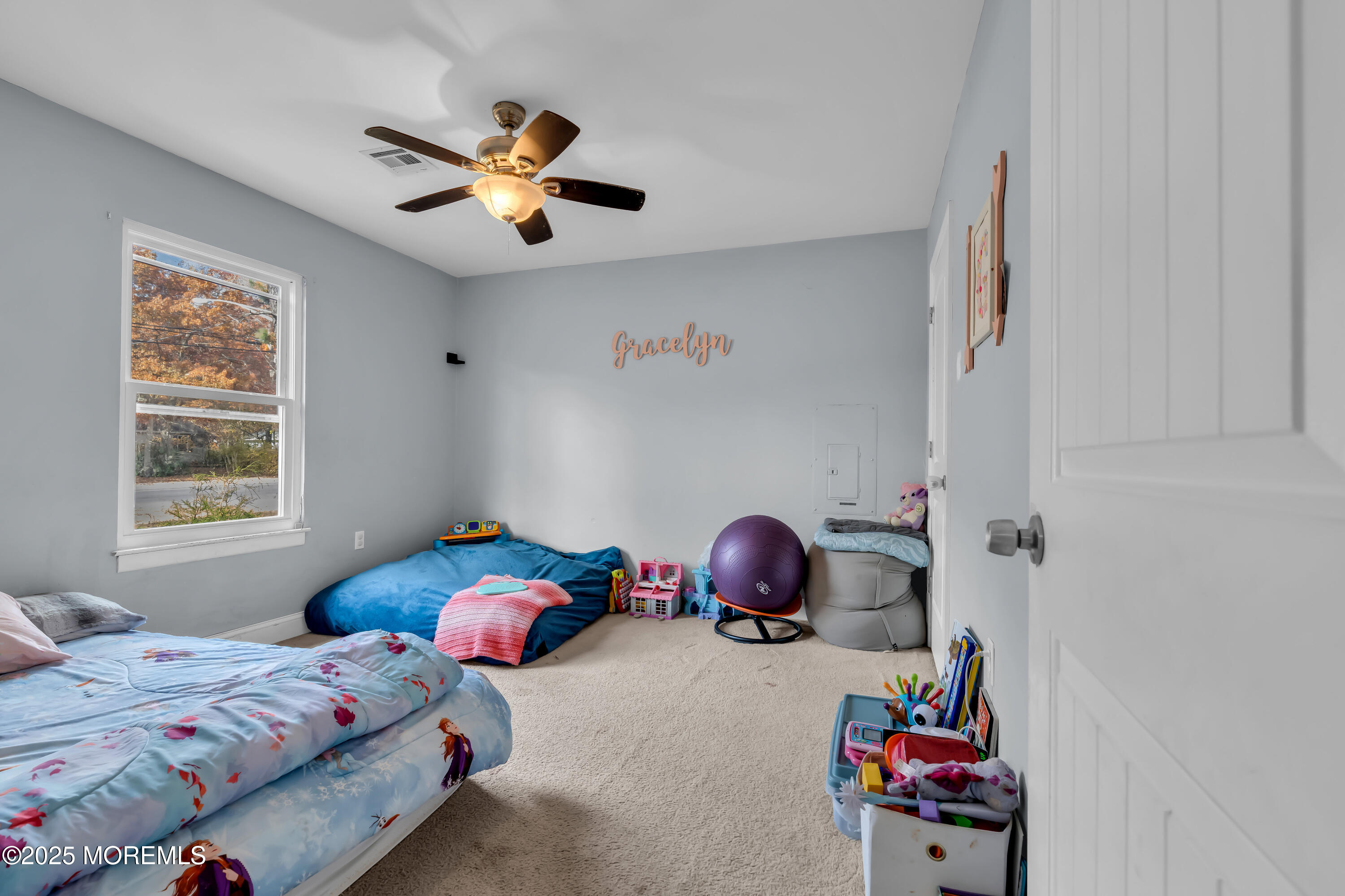 355 Western Boulevard Bayville, NJ 08721 - Photo 17 of 39 a bedroom with a bed and a chandelier