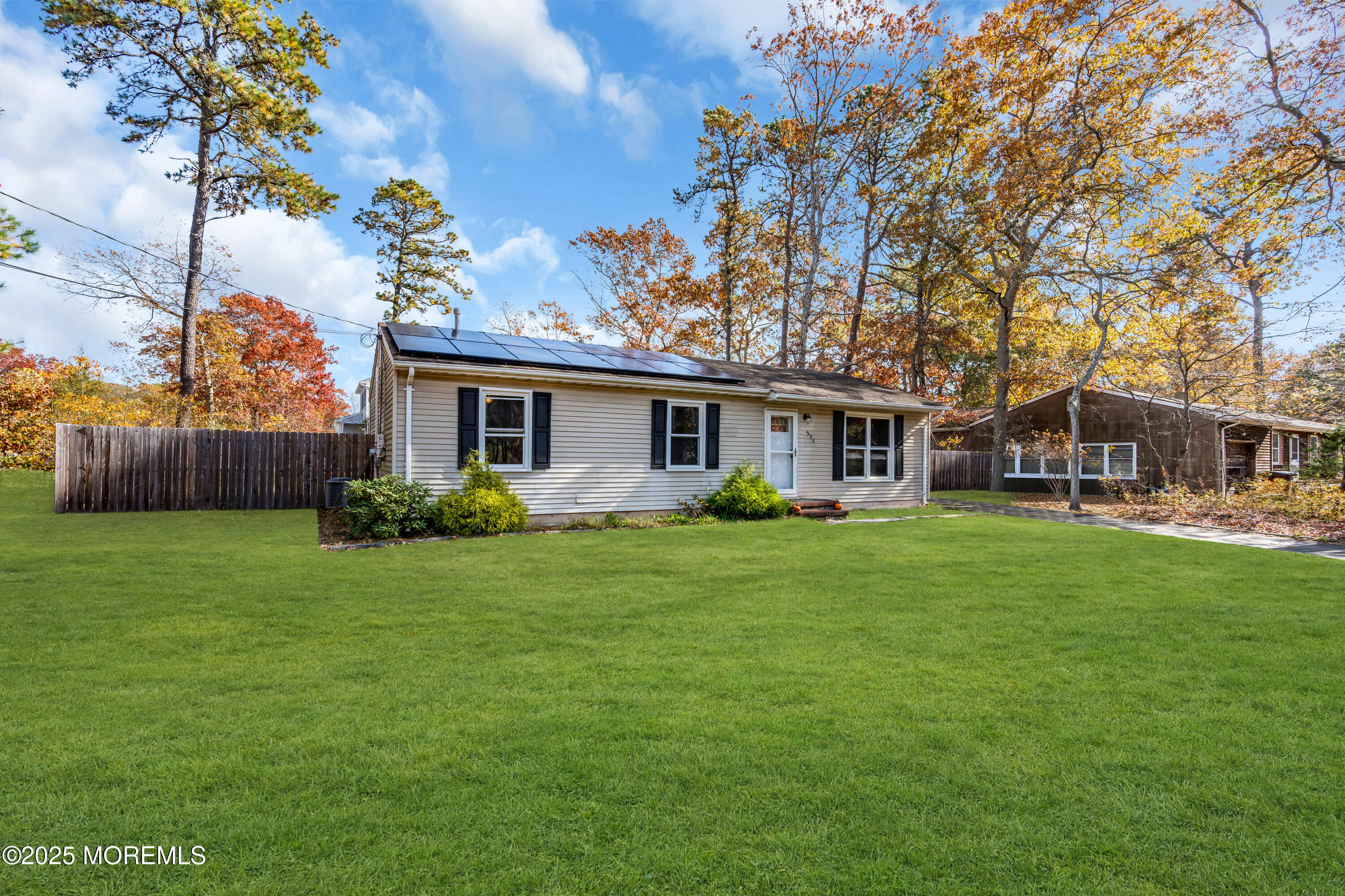 355 Western Boulevard Bayville, NJ 08721 - Photo 2 of 39 a front view of a house with a garden