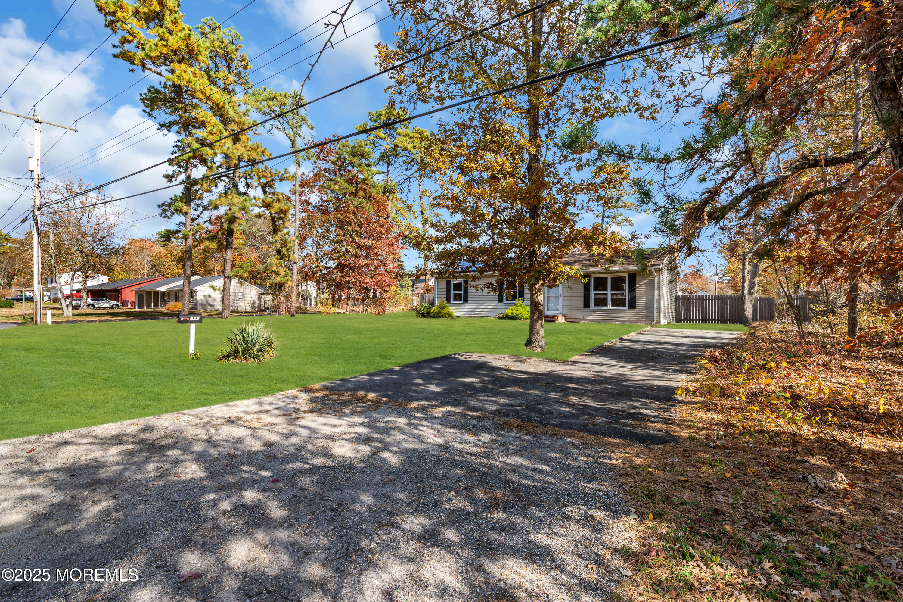 355 Western Boulevard Bayville, NJ 08721 - Photo 39 of 39 a house with huge green field in front of it