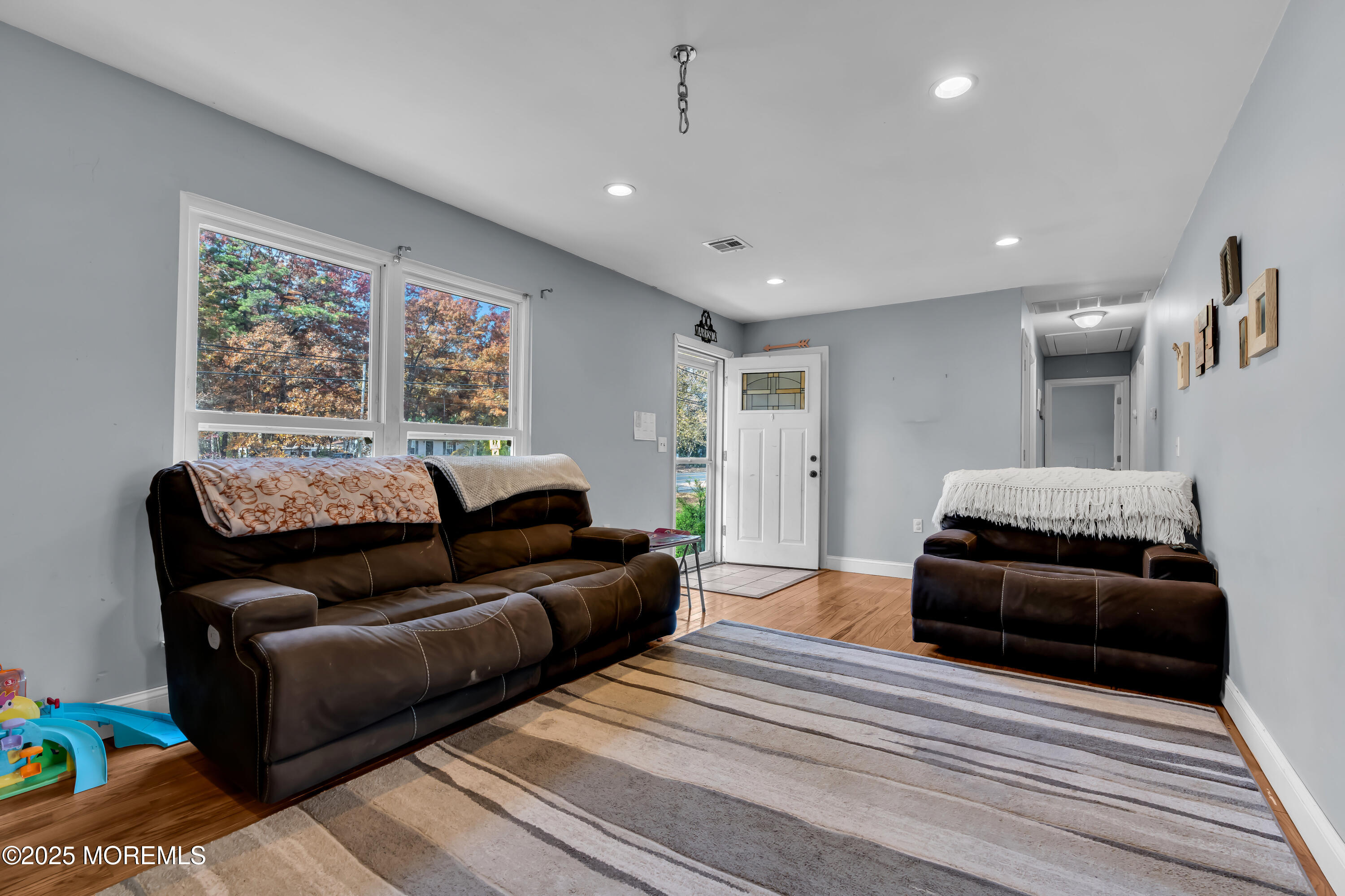 355 Western Boulevard Bayville, NJ 08721 - Photo 5 of 39 a living room with furniture and a large window