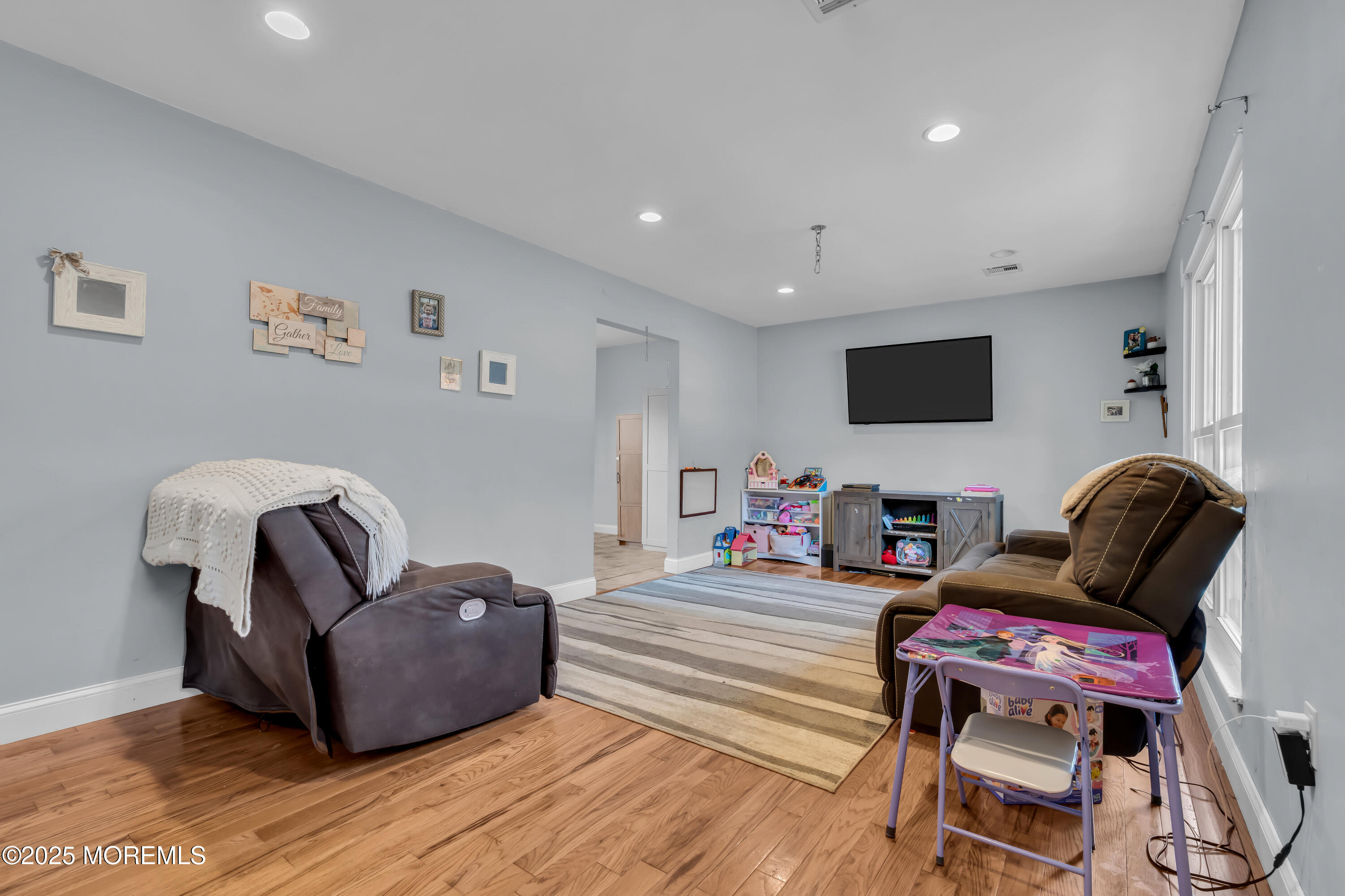 355 Western Boulevard Bayville, NJ 08721 - Photo 6 of 39 a living room with furniture a flat screen tv and rug