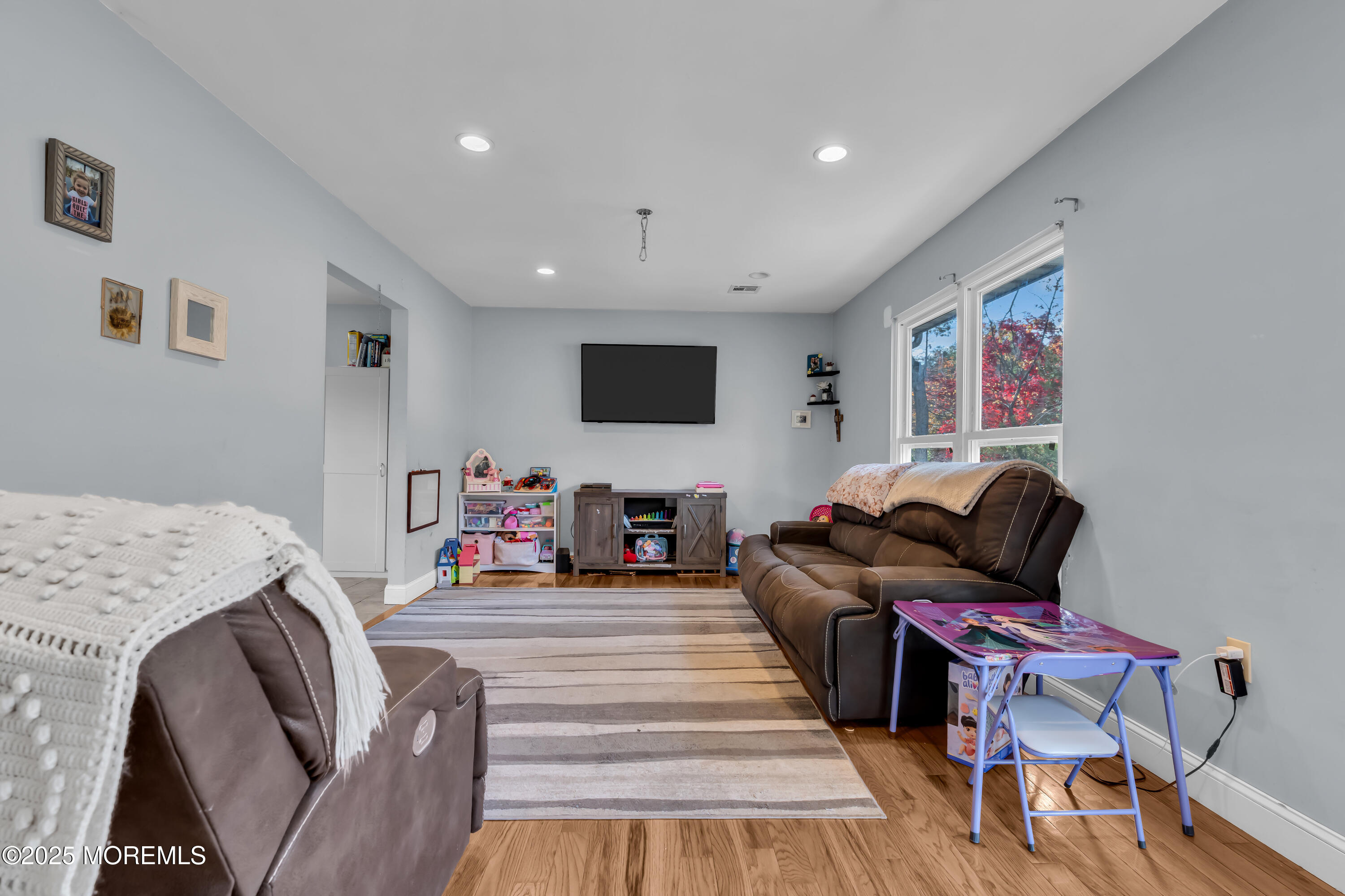 355 Western Boulevard Bayville, NJ 08721 - Photo 7 of 39 a living room with furniture and a flat screen tv