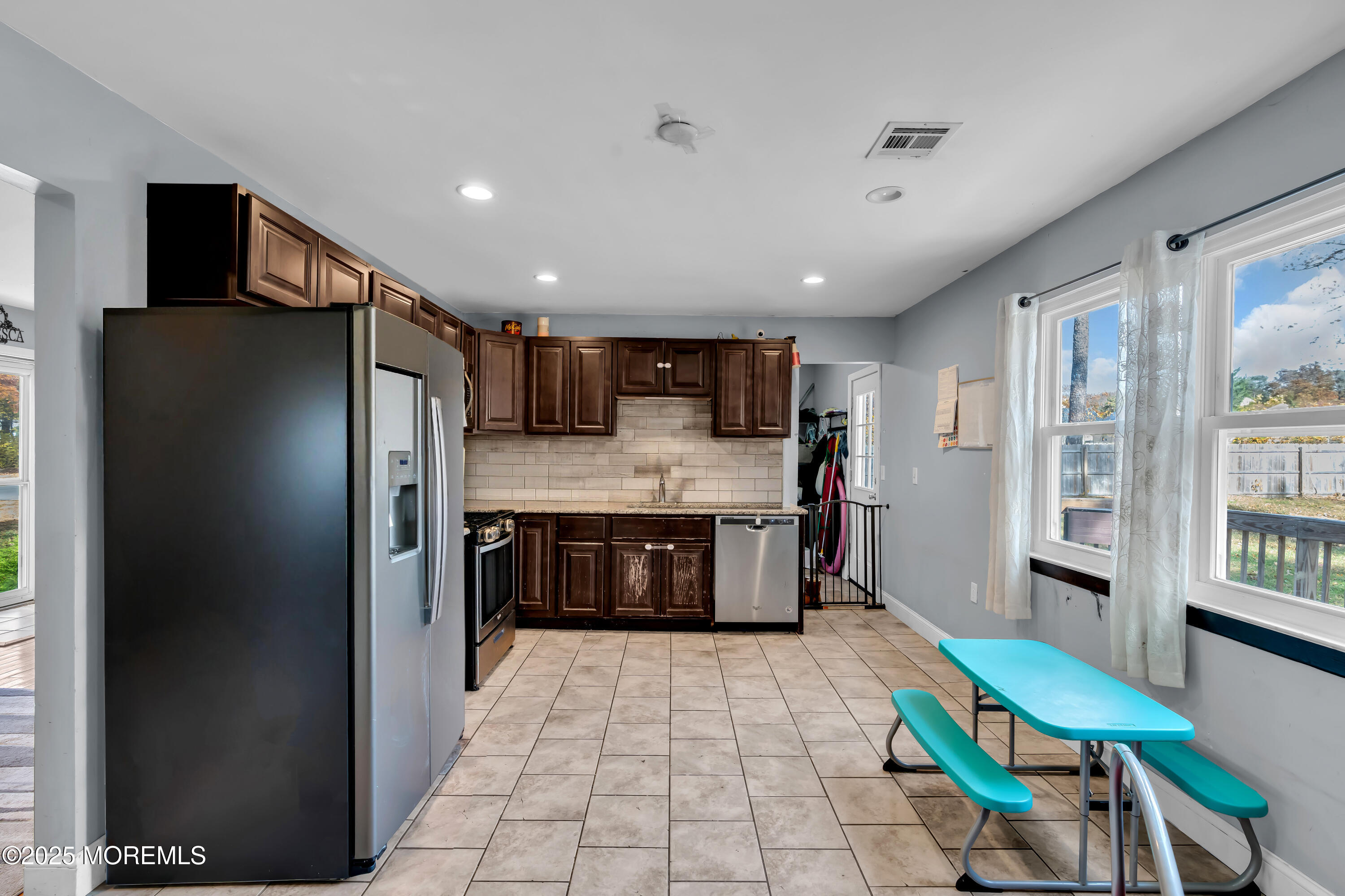 355 Western Boulevard Bayville, NJ 08721 - Photo 10 of 39 a kitchen with stainless steel appliances granite countertop a refrigerator and a sink
