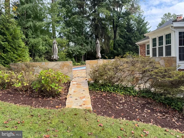 a view of a backyard with sitting area