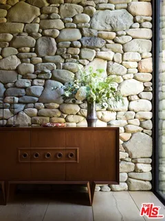 a balcony with table and chairs