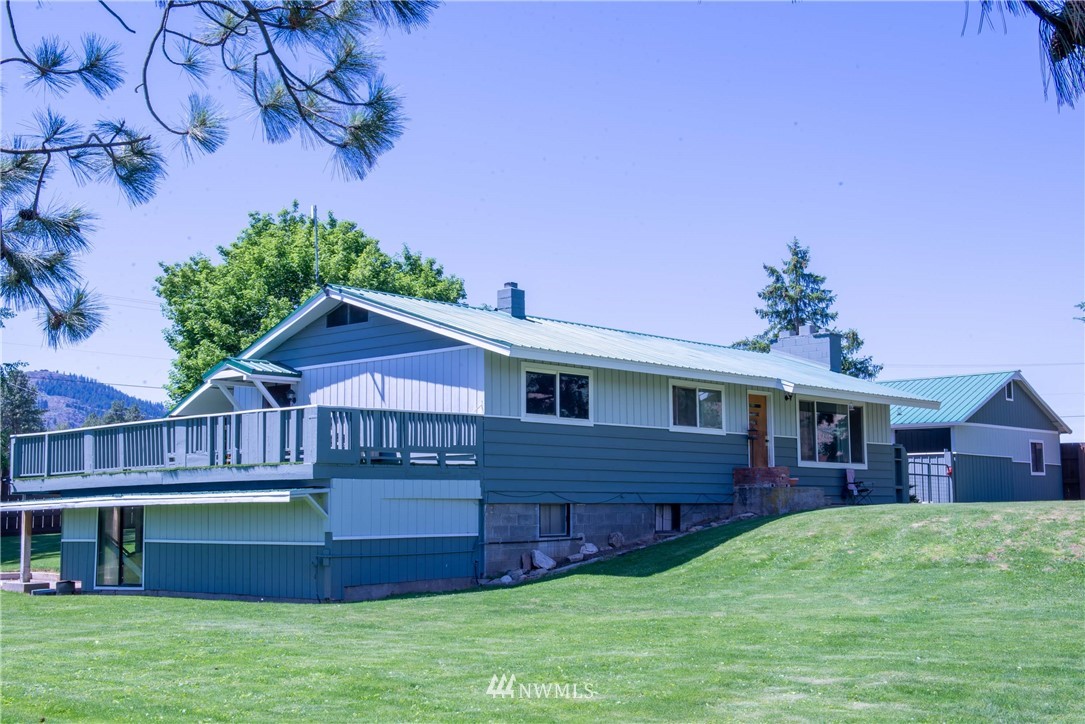 78 Mundy Road Twisp, WA 98856 - Photo 1 of 40 a view of a house with a garden