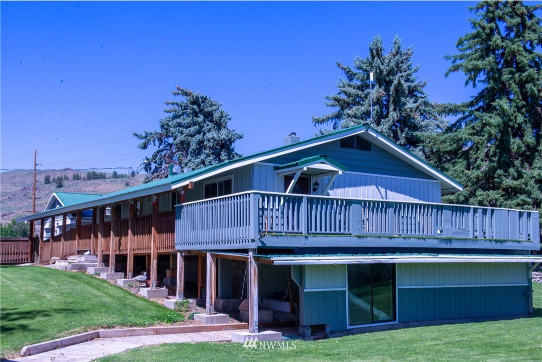 78 Mundy Road Twisp, WA 98856 - Photo 2 of 40 a front view of a house with garden
