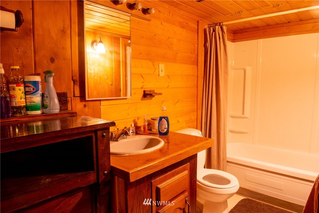 78 Mundy Road Twisp, WA 98856 - Photo 12 of 40 a bathroom with a sink and a mirror