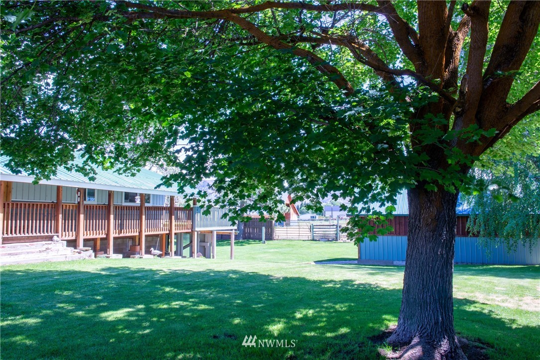 78 Mundy Road Twisp, WA 98856 - Photo 27 of 40 a view of a house with a backyard