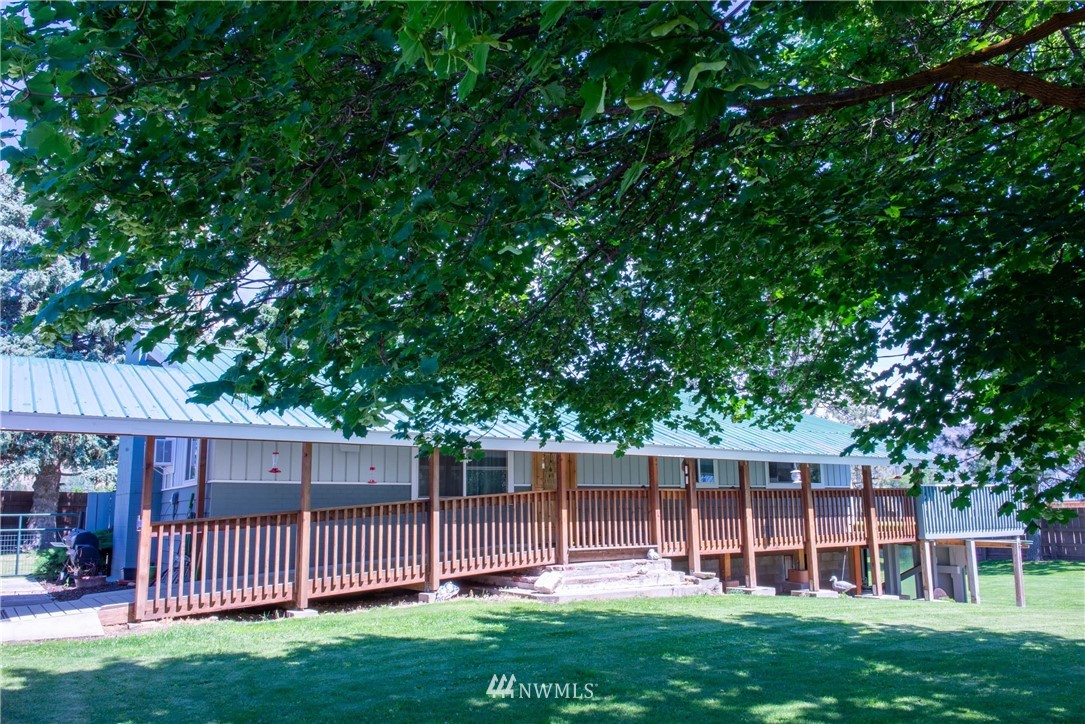 78 Mundy Road Twisp, WA 98856 - Photo 28 of 40 a view of a backyard with a garden and deck